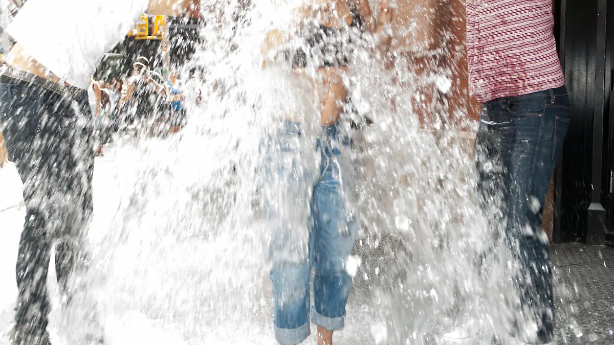 Rita Ora completes the ALS ICE Bucket challenge out side her NYC Hotel and challenges Iggy Azalea to do the challenge next.  