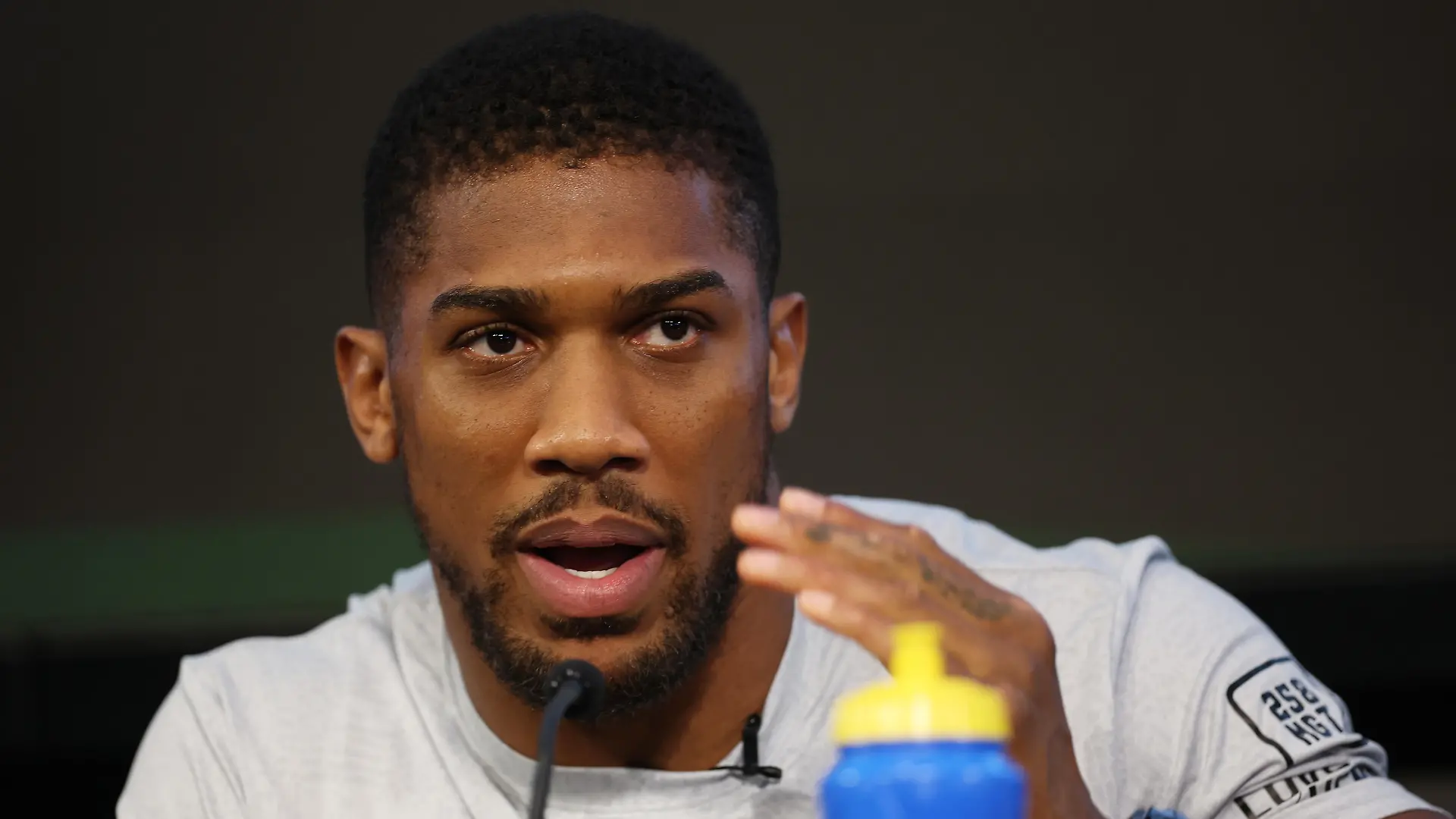 LONDON, ENGLAND - AUGUST 09: Anthony Joshua talks to the media during a press conference ahead of his upcoming Heavyweight fight against Robert Helenius on August 09, 2023 in London, England. (Photo by Eddie Keogh/Getty Images)