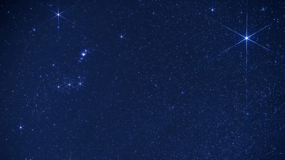 Thousands of stars shine in the sky on a dark night, with Sirius (upper right corner) and Orion constellation (to the left). Sirius is the brightest star in Earth's night sky, the name means "glowing" in Greek. Picture taken in March, Atacama Desert, Chile. Orion is one of the most recognizable constellations in the night sky named after a hunter in Greek mythology. Its brightest stars are Betelgeuse (Alpha Orionis,  red supergiant in the lower left corner, and Rigel (Beta Orionis, blue-white supergiant in the upper left corner). Three stars in a row (Mintaka, Alnilam and Alnitak) form Orion’s Belt while another three slightly up are Hunter’s Sword with hazy Messier M42 Orion Nebula.