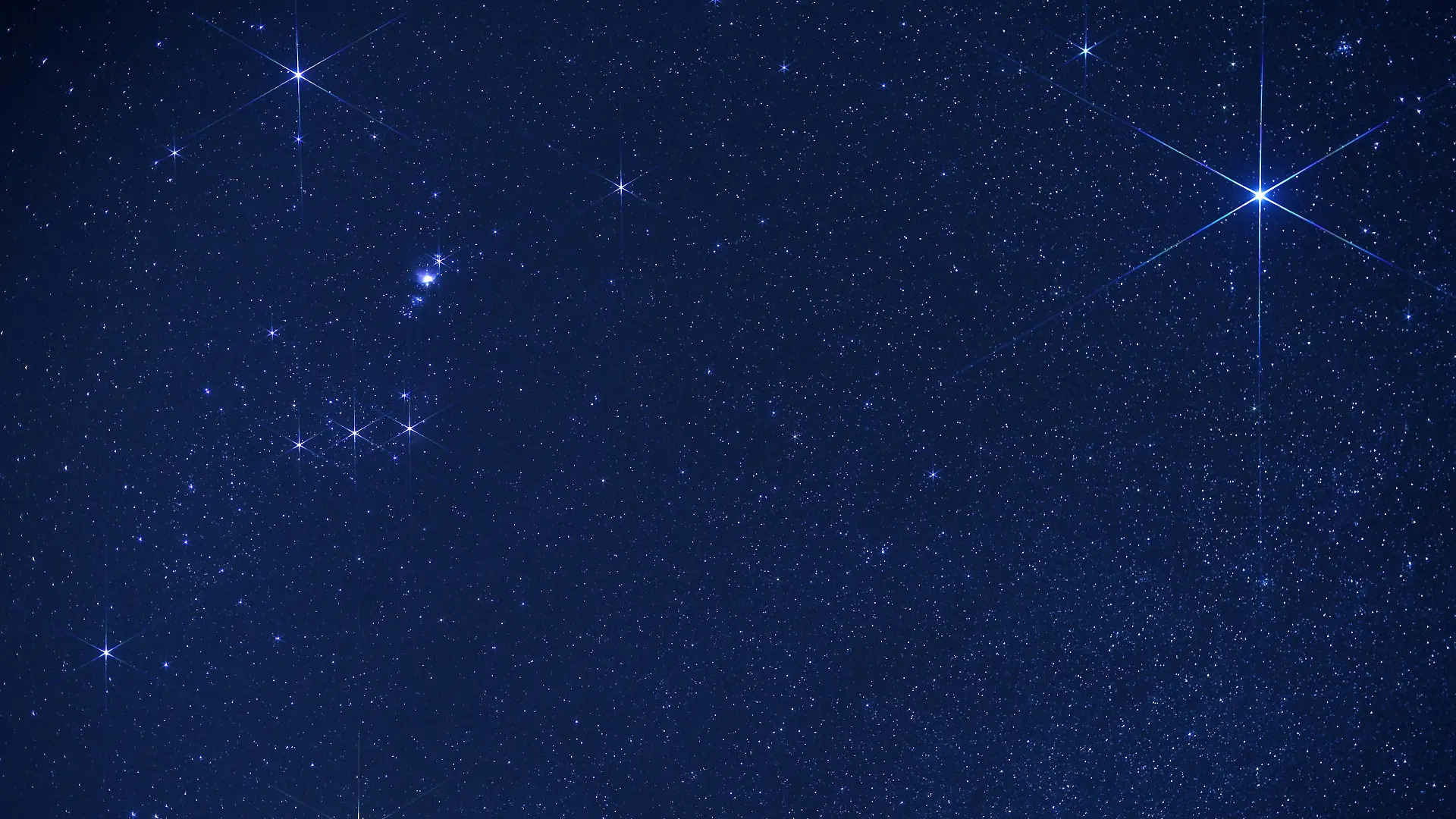 Thousands of stars shine in the sky on a dark night, with Sirius (upper right corner) and Orion constellation (to the left). Sirius is the brightest star in Earth's night sky, the name means "glowing" in Greek. Picture taken in March, Atacama Desert, Chile. Orion is one of the most recognizable constellations in the night sky named after a hunter in Greek mythology. Its brightest stars are Betelgeuse (Alpha Orionis, red supergiant in the lower left corner, and Rigel (Beta Orionis, blue-white supergiant in the upper left corner). Three stars in a row (Mintaka, Alnilam and Alnitak) form Orion’s Belt while another three slightly up are Hunter’s Sword with hazy Messier M42 Orion Nebula.