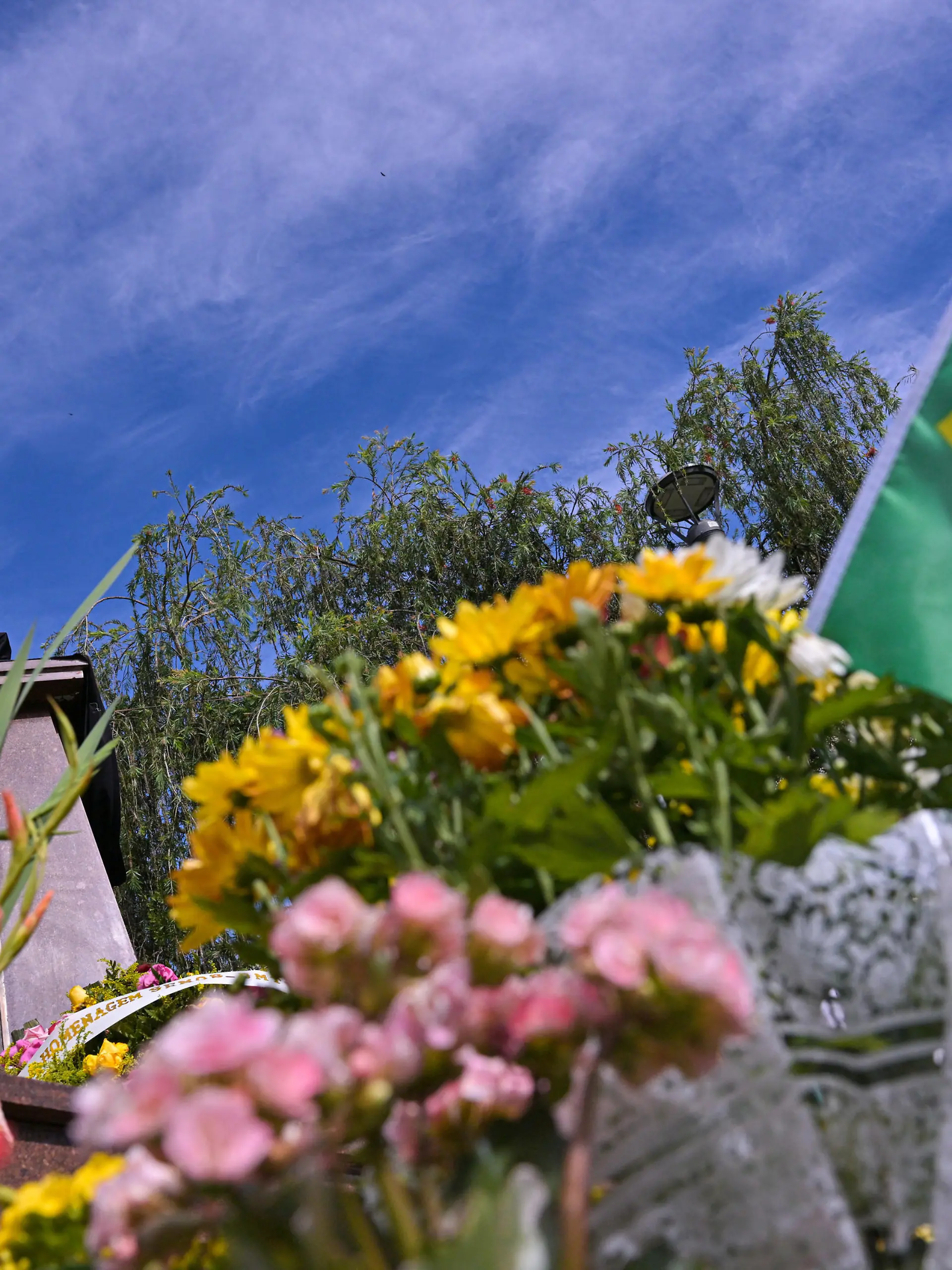 TRES CORACOES, BRAZIL - JANUARY 1: Bouquets and wreath of flowers are seen at the foot of a statue of Pele at Pele Square in his hometown Tres Coracoes, state of Minas Gerais, Brazil, on January 1, 2023 in Tres Coracoes, Brazil. Brazilian football icon Edson Arantes do Nascimento, better known as Pele, died on December 29, 2022 aged 82 after a battle with cancer in Sao Paulo, Brazil. The three-time World Cup champion with Brazil is considered one of the greatest football legends of all time. (Photo by Pedro Vilela/Getty Images)