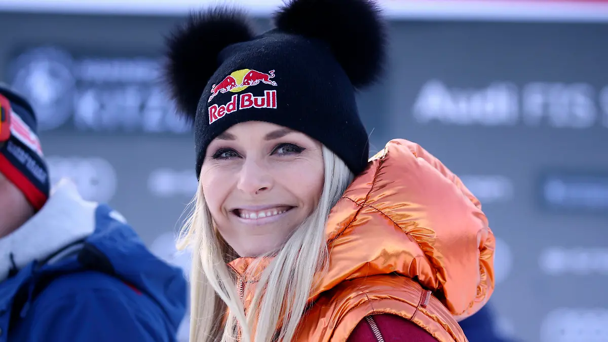 FILE- In this Friday, Jan. 24, 2020, file photo, Former ski star Lindsey Vonn, of United States, smiles in the finish area during the men's World Cup super G alpine ski race in Kitzbuehel, Austria. Vonn, the winningest woman in World Cup history, is scheduled to call the women’s downhill and super-G races in Crans Montana, Switzerland, this weekend for NBC Sports. (AP Photo/Marco Trovati, File)