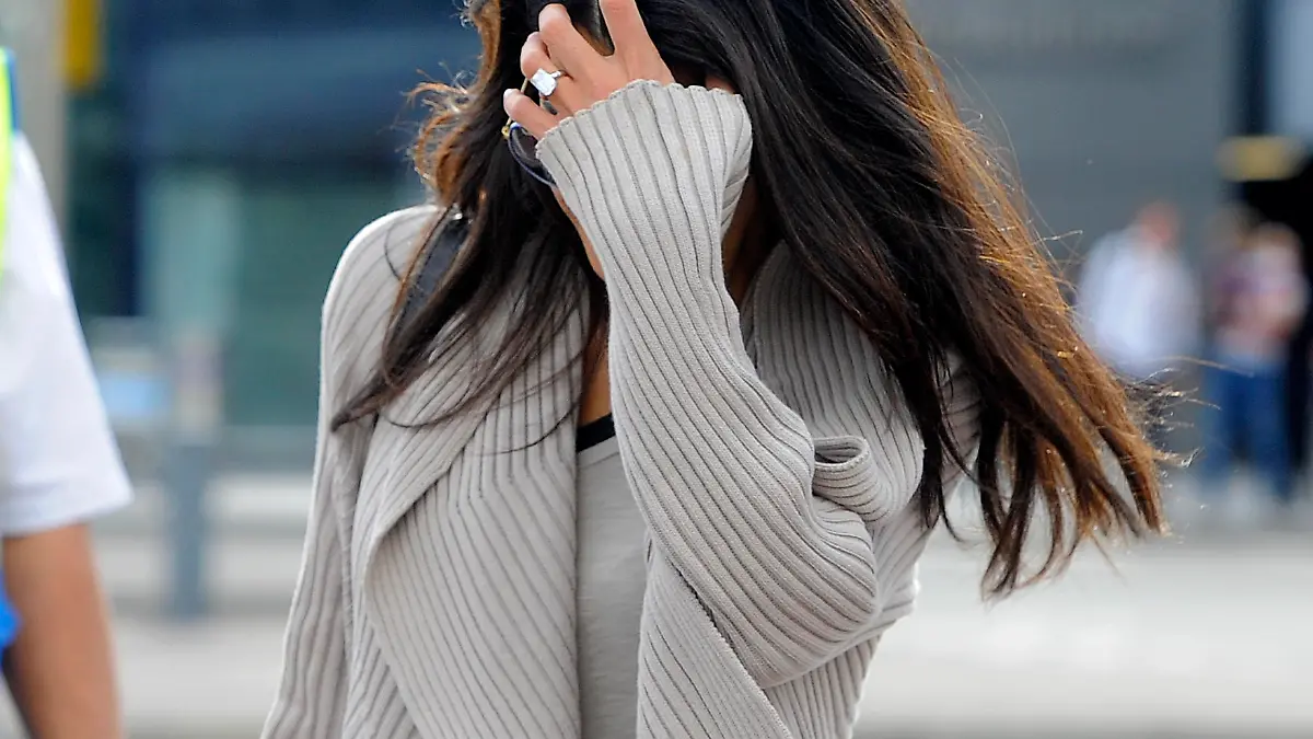 George Clooney's fiance, Amal Alamuddin arrives at Heathrow Airport in London. She was pictured wearing her 450,000 pound ring.