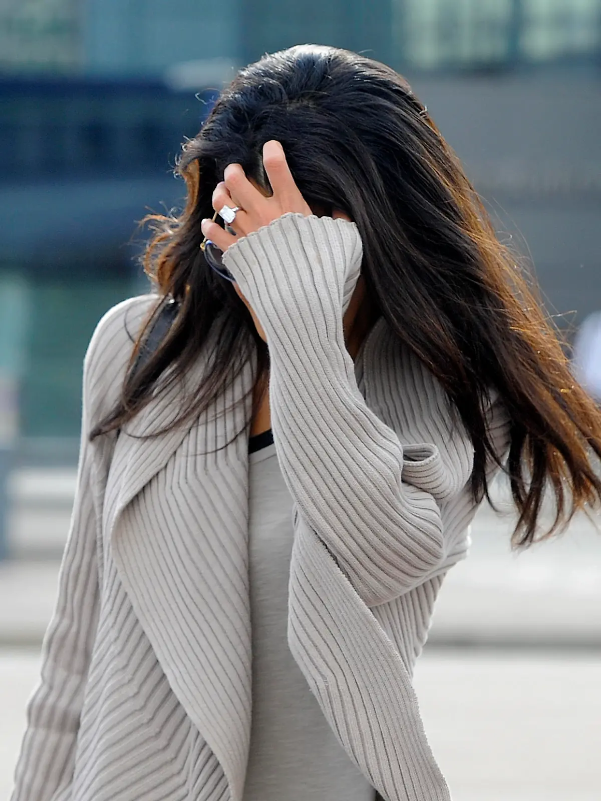 George Clooney's fiance, Amal Alamuddin arrives at Heathrow Airport in London. She was pictured wearing her 450,000 pound ring.