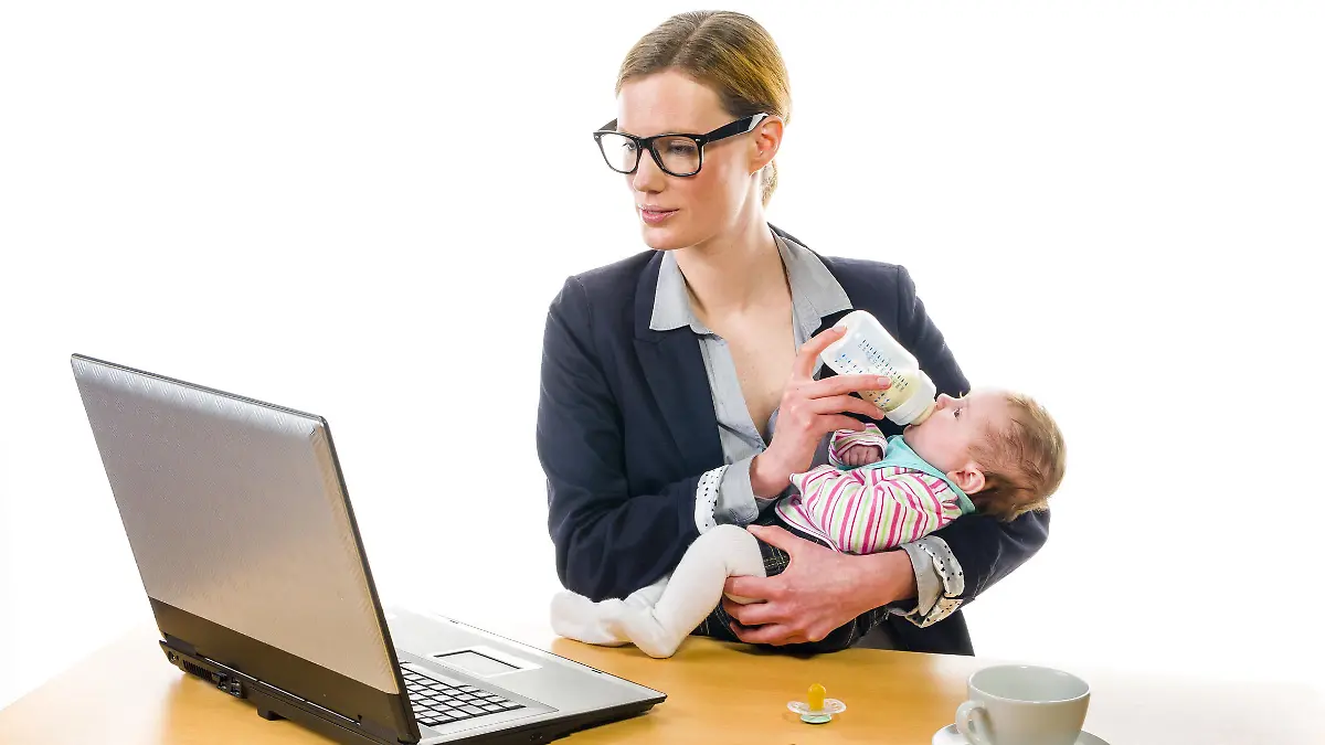 Adult business woman wearing a costume and supplied her newborn daughter in the office workplace, isolated against a white background.