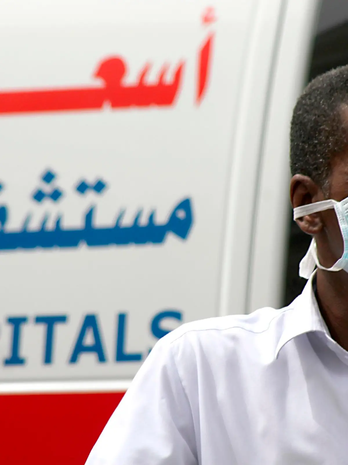 A man, wearing a surgical mask as a precautionary measure against the novel coronavirus, walks near a hospital in Khobar city in Dammam May 21, 2013. Saudi Arabia has reported another case of infection in a concentrated outbreak of a new strain of a virus that emerged in the Middle East last year and spread into Europe, the World Health Organization (WHO) said on May 18, 2013. In a disease outbreak update issued from its Geneva headquarters, the WHO said the latest patient is an 81-year-old woman with multiple medical conditions. She became ill on April 28 and is in a critical but stable condition. Worldwide, there have now been 41 laboratory-confirmed infections, including 20 deaths, since the new coronavirus was identified by scientists in September 2012. REUTERS/Stringer (SAUDI ARABIA - Tags: HEALTH SOCIETY)