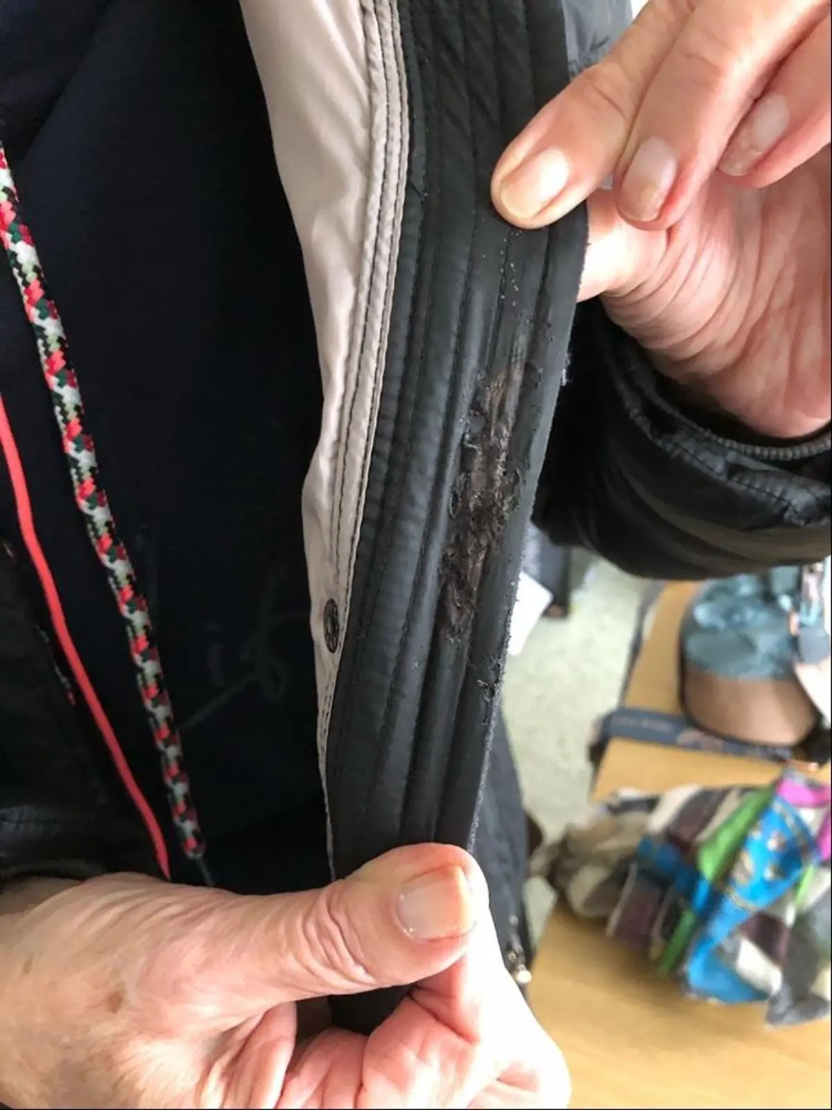 Beschädigte Jacke