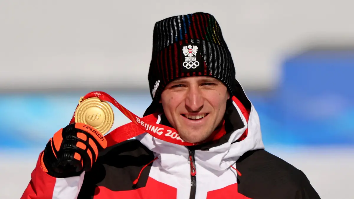 FILE PHOTO: Super-G gold medalist Matthias Mayer of Austria poses with his medal during victory ceremony at 2022 Beijing Olympics - National Alpine Skiing Centre, Yanqing district, Beijing, China - February 8, 2022. REUTERS/Jorge Silva/File Photo