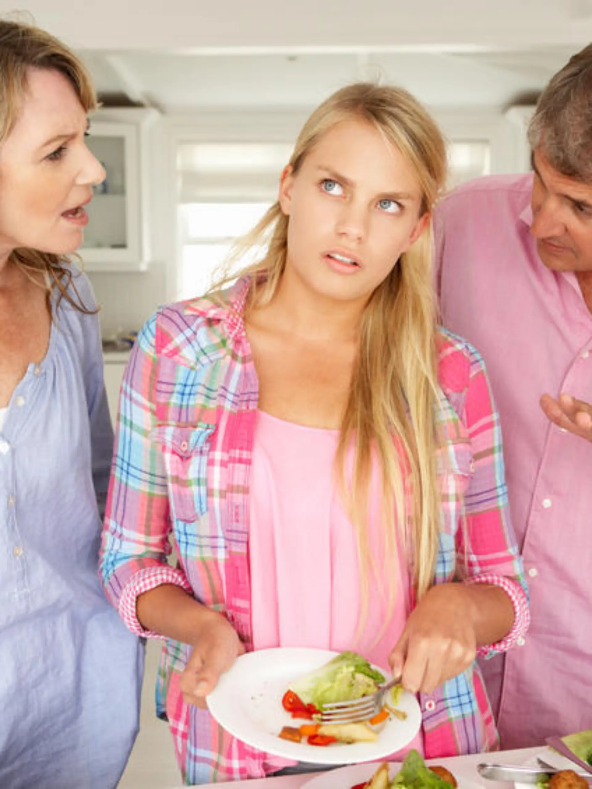 Parents making teenage daughter do chores at home