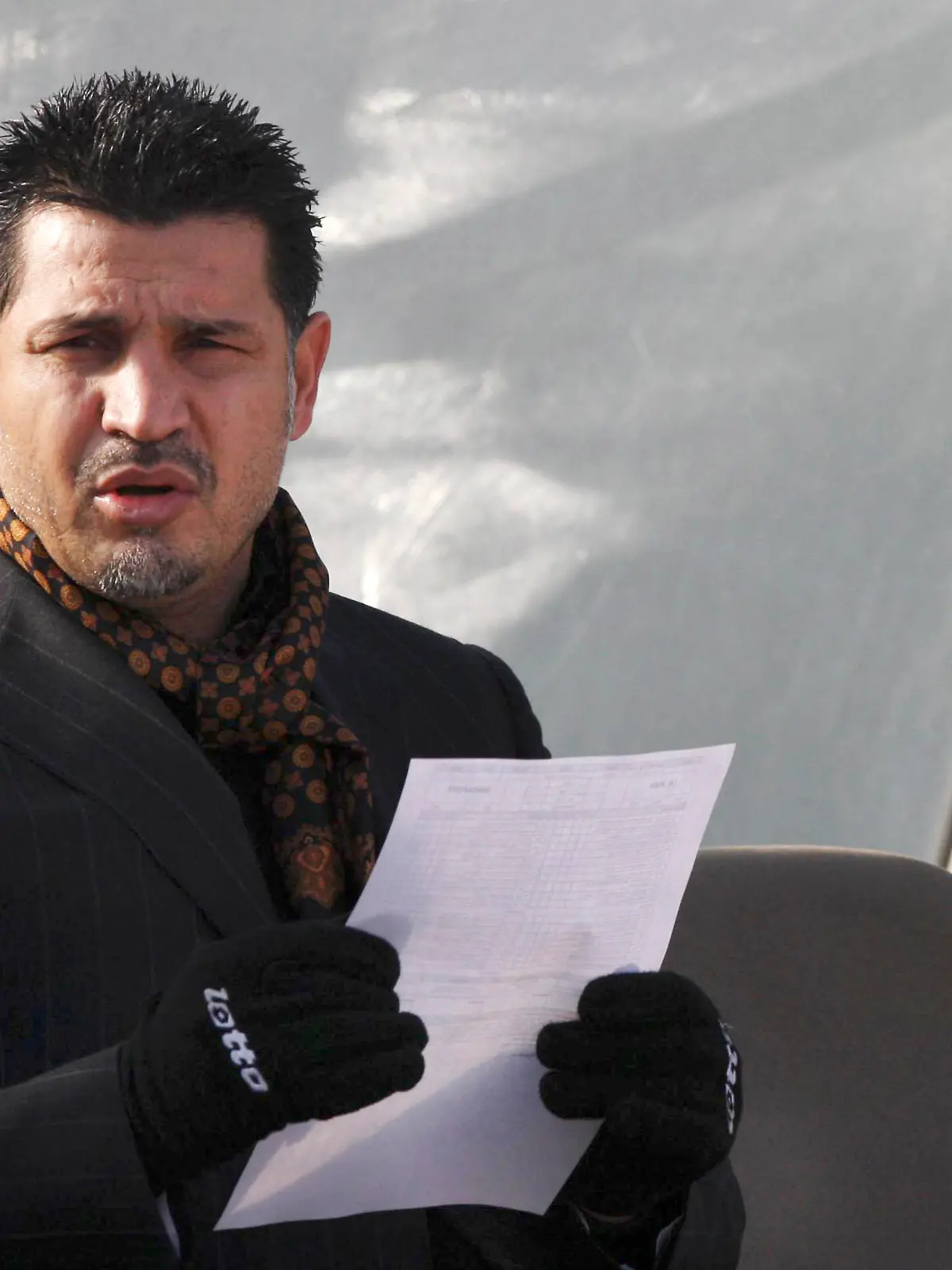 FILE - Former Iran's national soccer team coach Ali Daei before an Asian Cup 2011 qualifying soccer match between Iran and Singapore in Tehran, Iran, Jan, 14, 2009. Daei has expressed support for anti-government protests, saying that his wife and daughter were prevented from leaving the country on Monday, Dec. 26, 2022, after their plane made an unannounced stopover en route to Dubai. (AP Photo/Hasan Sarbakhshian, File)