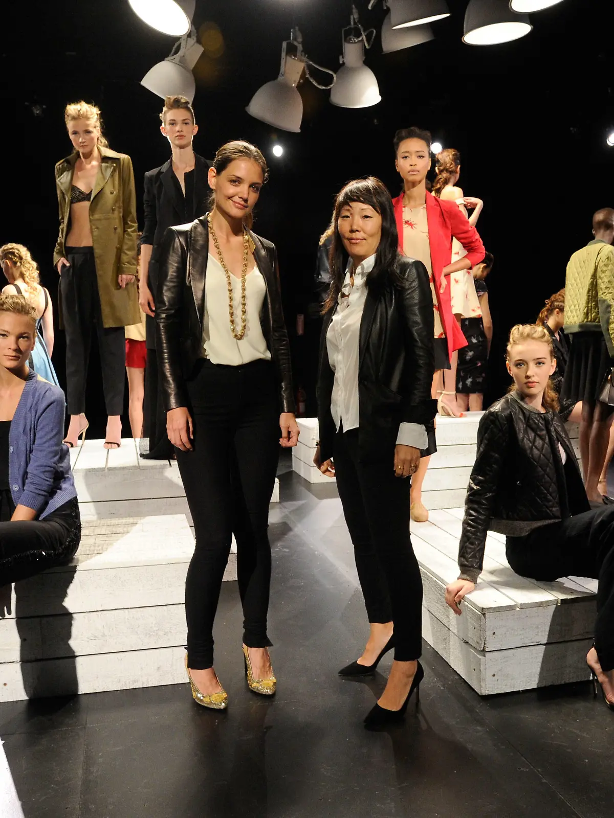 NEW YORK, NY - SEPTEMBER 12:  Katie Holmes, Jeanne Yang and models rehearse for the Holmes & Yang presentation during Spring 2013 Mercedes-Benz Fashion Week at The Box at Lincoln Center on September 12, 2012 in New York City.  (Photo by Kevin Mazur/Getty Images)