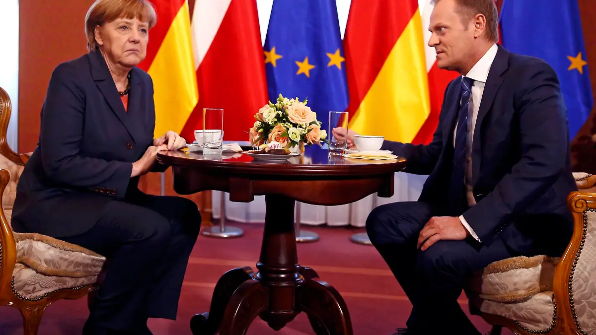 German Chancellor Angela Merkel reacts as she talks with Polish Prime Minister Donald Tusk in Warsaw March 12, 2014. Merkel is visiting Poland to discuss the crisis in Ukraine. REUTERS/Kacper Pempel (POLAND  - Tags: POLITICS)  