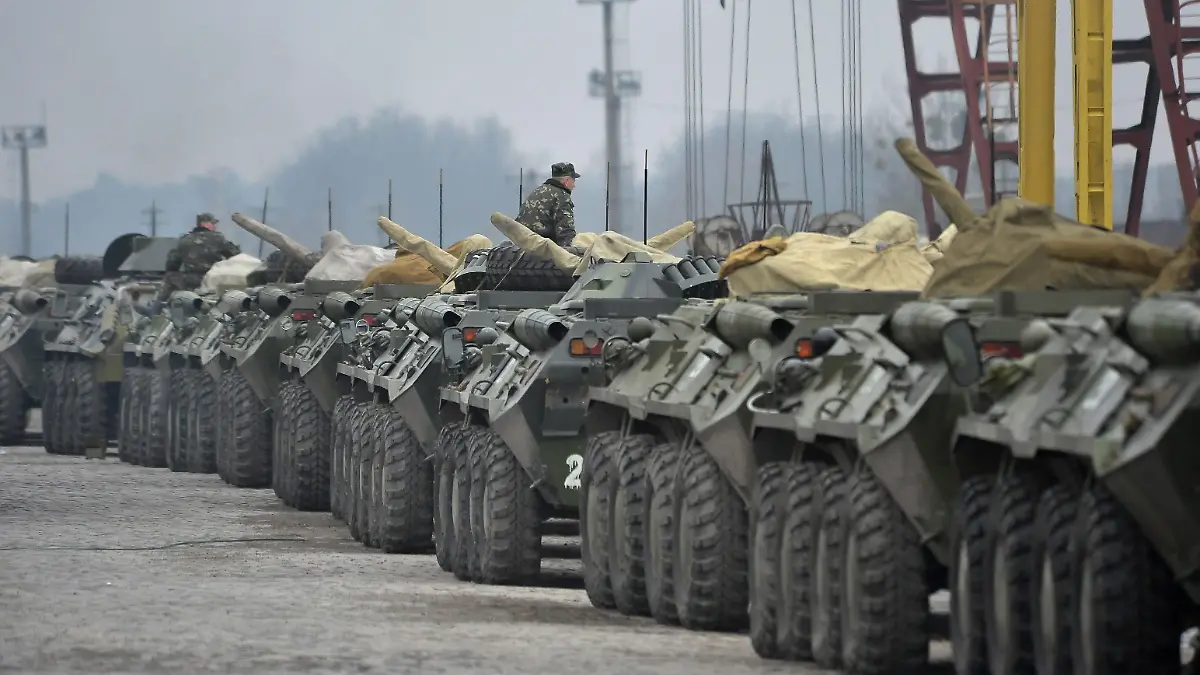 epa04115854 Ukrainian military vehicles line up to be loaded on flatcars at a railway station not far of Lviv, Ukraine, 08 March 2014. The USA and European Union have threatened sanctions against Moscow over the military standoff in the strategic Crimean peninsula, and are urging Russia to pull back its forces in the region and allow in international observers and human rights monitors. Crimea, which has a majority ethnic Russian population, is strategically important to Russia as the home port of its Black Sea Fleet. EPA/IVAN BOBERSKYY