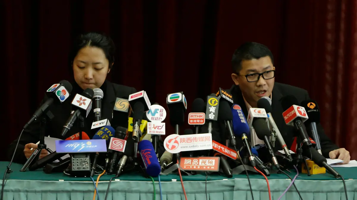 Malaysia Airlines representatives speak at a news conference about information on Malaysia Airlines flight MH370, at a hotel in Beijing March 9, 2014. A missing Malaysia Airlines jetliner may have turned back from its scheduled route before vanishing from radar screens, military officers said on Sunday, deepening the mystery surrounding the fate of the plane and the 239 people aboard. REUTERS/Jason Lee (CHINA - Tags: TRANSPORT DISASTER MEDIA)