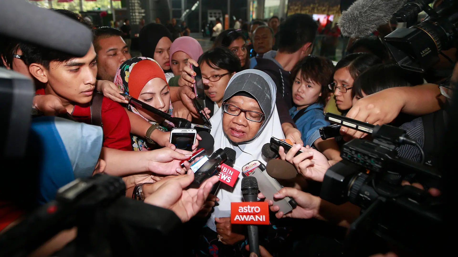 Family members of those onboard the missing Malaysia Airlines flight MH370 are interviewed by media at the waiting area at Kuala Lumpur International Airport in Sepang March 8, 2014. A Malaysia Airlines flight carrying 227 passengers and 12 crew went missing over the South China Sea on Saturday, presumed crashed, as ships from countries closest to its flight path scoured a large search area for any wreckage. Vietnamese state media, quoting a senior naval official, had reported that the Boeing 777-200ER flight from Kuala Lumpur to Beijing had crashed off south Vietnam, but Malaysia's transport minister later denied any crash scene had been identified. REUTERS/Samsul Said (MALAYSIA - Tags: TRANSPORT DISASTER)