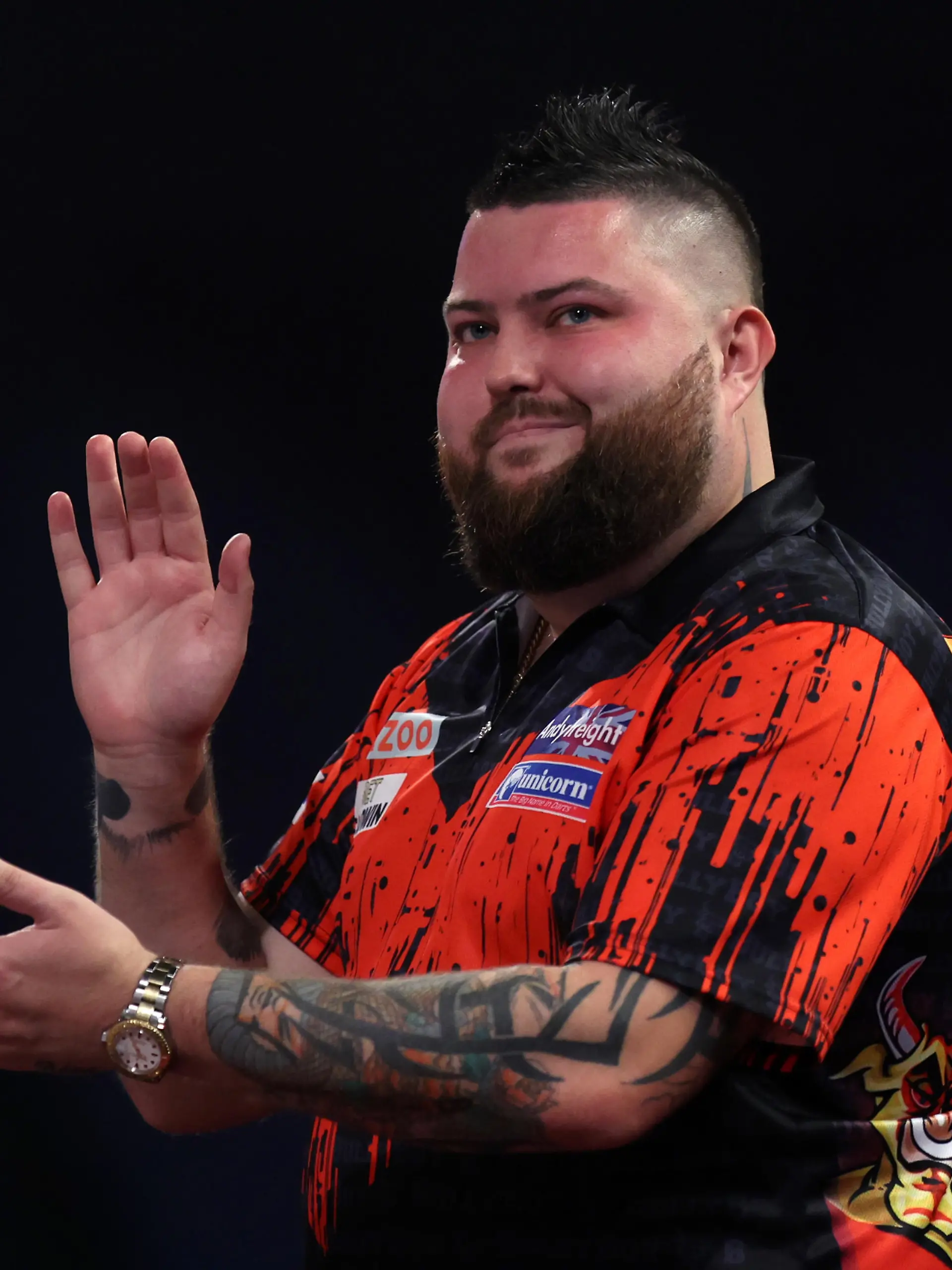 LONDON, ENGLAND - DECEMBER 28: Michael Smith of England reacts during his Third Round match against Martin Schindler of Germany during Day Nine of The Cazoo World Darts Championship at Alexandra Palace on December 28, 2022 in London, England. (Photo by Mike Owen/Getty Images)