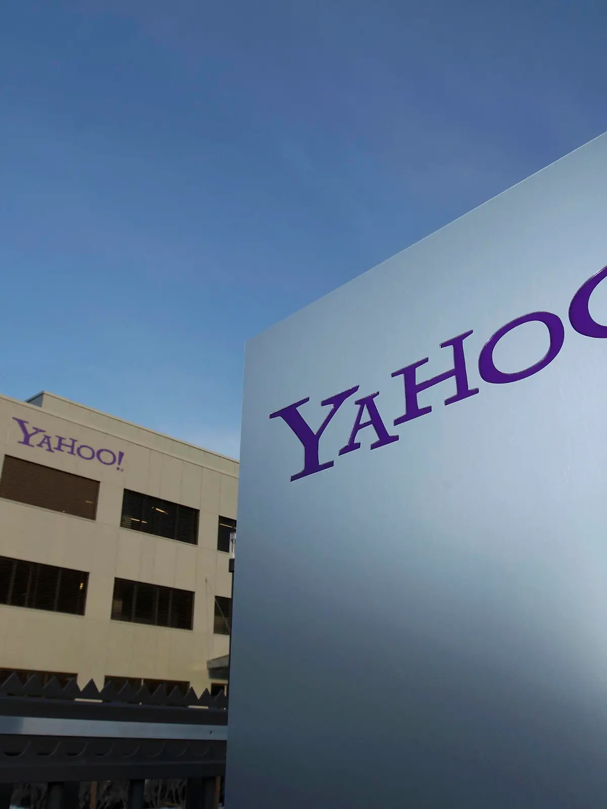A Yahoo logo is pictured in front of a building in Rolle, 30 km (19 miles) east of Geneva, in this file picture taken December 12, 2012. Yahoo! Inc is shifting its main European tax base to Ireland from Switzerland, a Reuters examination of company statements and accounts shows, as pressure mounts on the Alpine nation to abolish some corporate tax incentives. Picture taken December 12, 2012.       REUTERS/Denis Balibouse (SWITZERLAND - Tags: BUSINESS POLITICS LOGO)