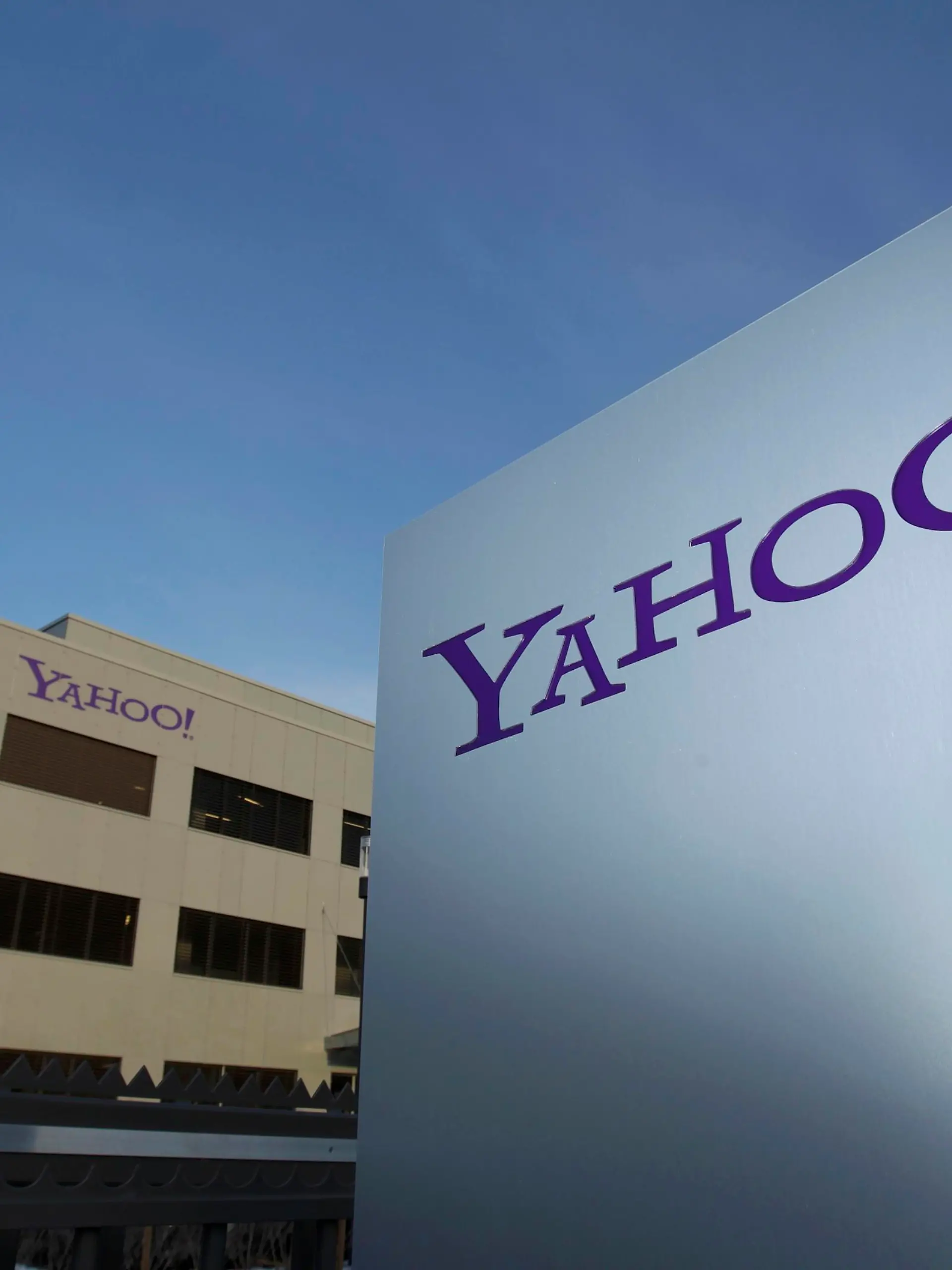 A Yahoo logo is pictured in front of a building in Rolle, 30 km (19 miles) east of Geneva, in this file picture taken December 12, 2012. Yahoo! Inc is shifting its main European tax base to Ireland from Switzerland, a Reuters examination of company statements and accounts shows, as pressure mounts on the Alpine nation to abolish some corporate tax incentives. Picture taken December 12, 2012.       REUTERS/Denis Balibouse (SWITZERLAND - Tags: BUSINESS POLITICS LOGO)