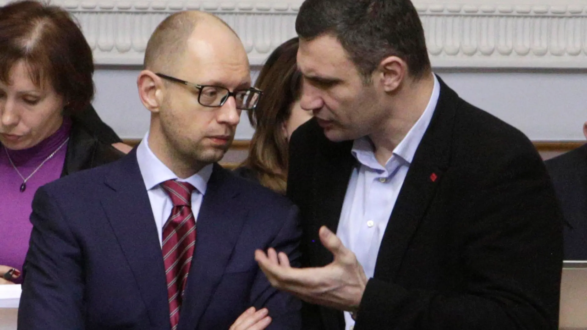 Protest leaders Vitaly Klitschko (R) and Arseny Yatsenyuk (2nd R) speak during a session of the Parliament in Kiev February 27, 2014. Ukraine's parliament agreed on Thursday the country should be led by a coalition government and proposed former economy minister Yatseniuk to lead it as prime minister. REUTERS/Konstantin Chernichkin (UKRAINE - Tags: POLITICS CIVIL UNREST PROFILE TPX IMAGES OF THE DAY)