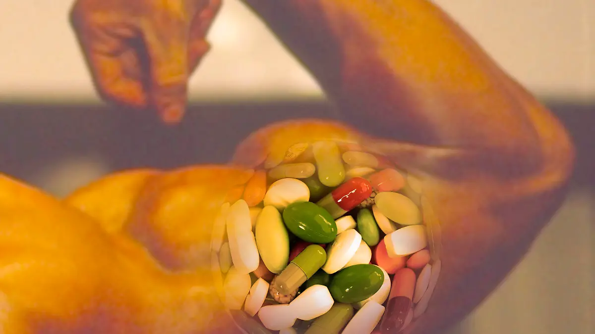 Pillen im Arm vom Bodybuilder Bizeps Muskeln / pills in arm of a bodybuilder biceps muscles Keine Weitergabe an Drittverwerter.
