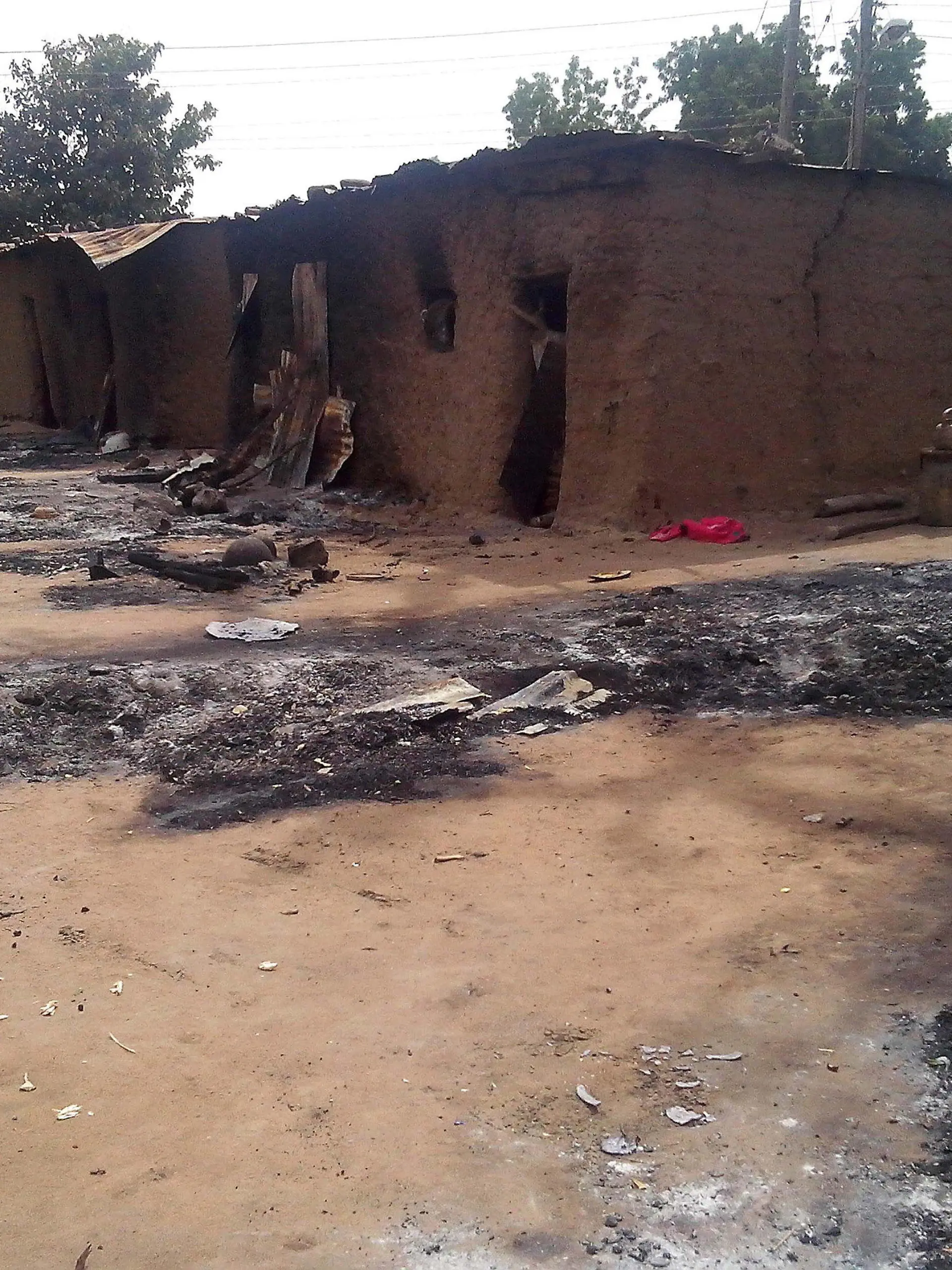 epa04100296 (FILE) A file photograph dated 28 January 2013 showing the remains of houses after a Boko Haram attack, killing 70 people, in Kawuri, Nigeria. Reports on 25 February 2014 state that suspected Islamist militants attacked a school 25 February 2014 and killed 43 people in north-eastern Nigeria, local officials and hospital sources said. More than 50 gunmen thought to belong to the Boko Haram group stormed the school in Buni Yadi in Yobe state in the early morning, a member of the school committee said. The attackers kicked open the doors of buildings where students were sleeping. They slit the throats of many of them, avoiding the use of firearms in order not to attract the attention of security personnel manning a checkpoint nearby. EPA/STRINGER +++(c) dpa - Bildfunk+++
