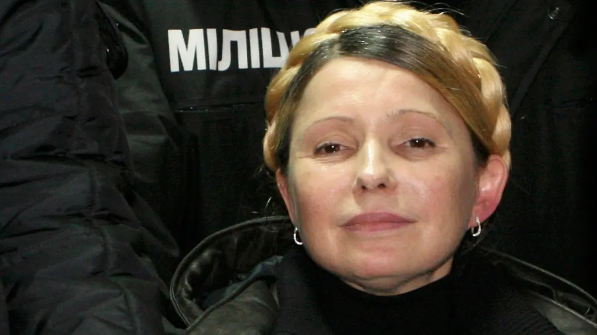 Ukrainian opposition leader Yulia Tymoshenko reacts after she was freed in Kharkiv February 22, 2014. Tymoshenko was freed on Saturday from the hospital where she had been held under prison guard for most of the time since she was convicted in 2011. The former prime minister, a bitter rival of President Viktor Yanukovich, waved to supporters from a car as she was driven out of the hospital in the northeastern city if Kharkiv, a Reuters photographer said. Tymoshenko, 53, was jailed in 2011 for abuse of office over a gas deal with Russia but her supporters and Western leaders say her trial was politically motivated. REUTERS/Inna Petrykova (UKRAINE - Tags: POLITICS CIVIL UNREST TPX IMAGES OF THE DAY)