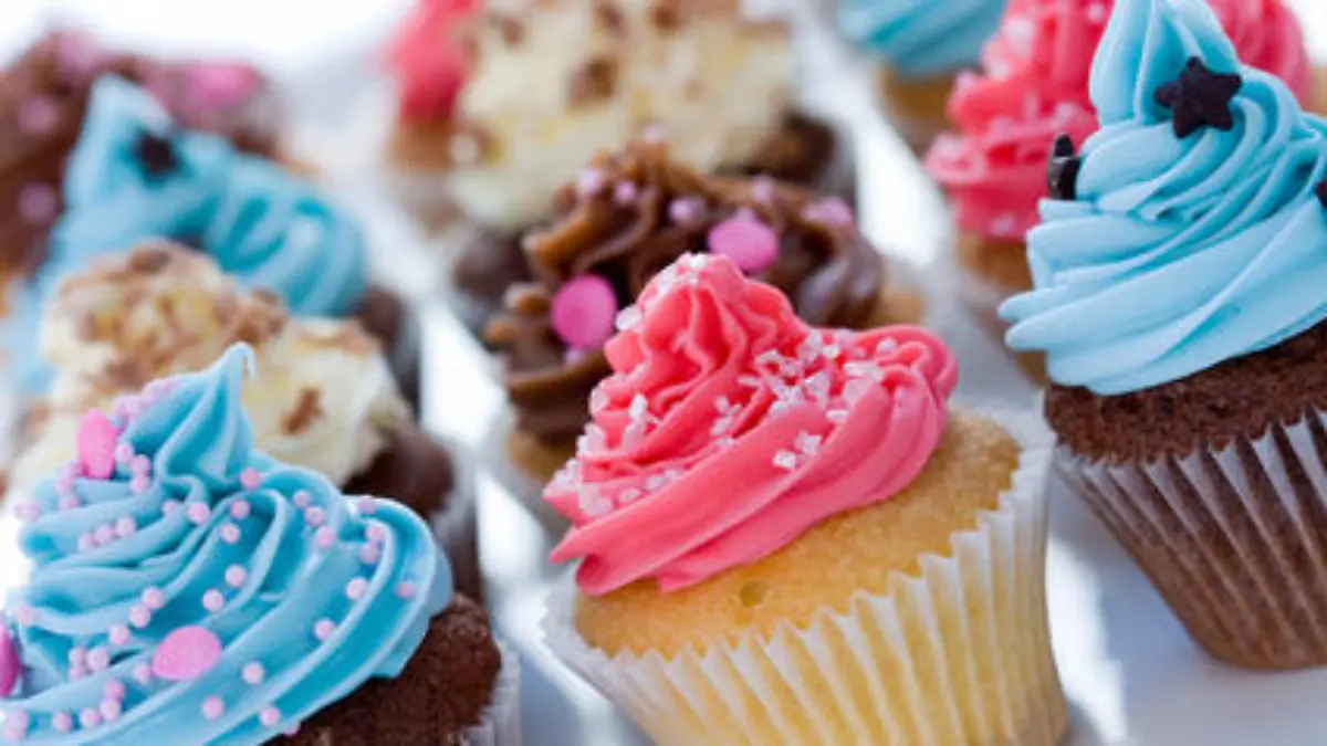 Assortment of delicious brightly colored cupcakes
