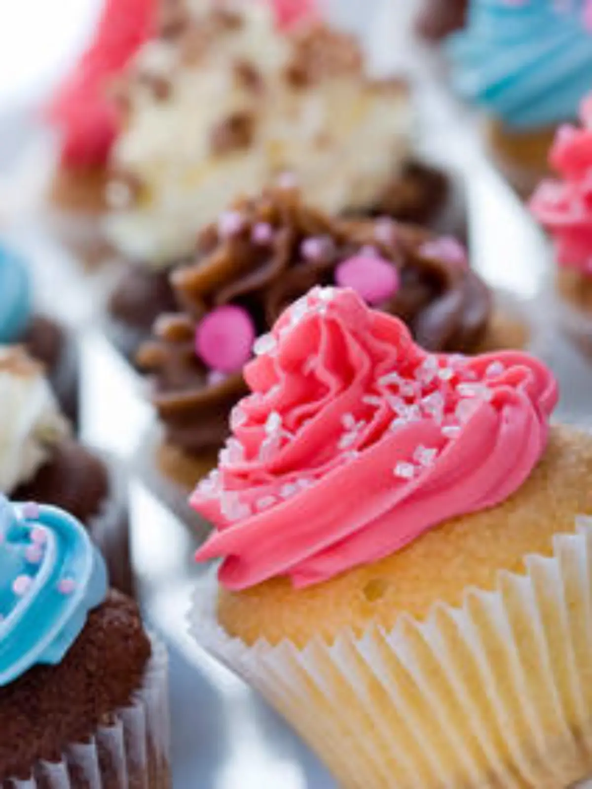 Assortment of delicious brightly colored cupcakes