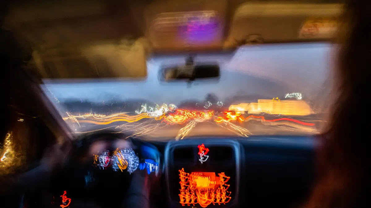 Blurred photo from inside a car at night