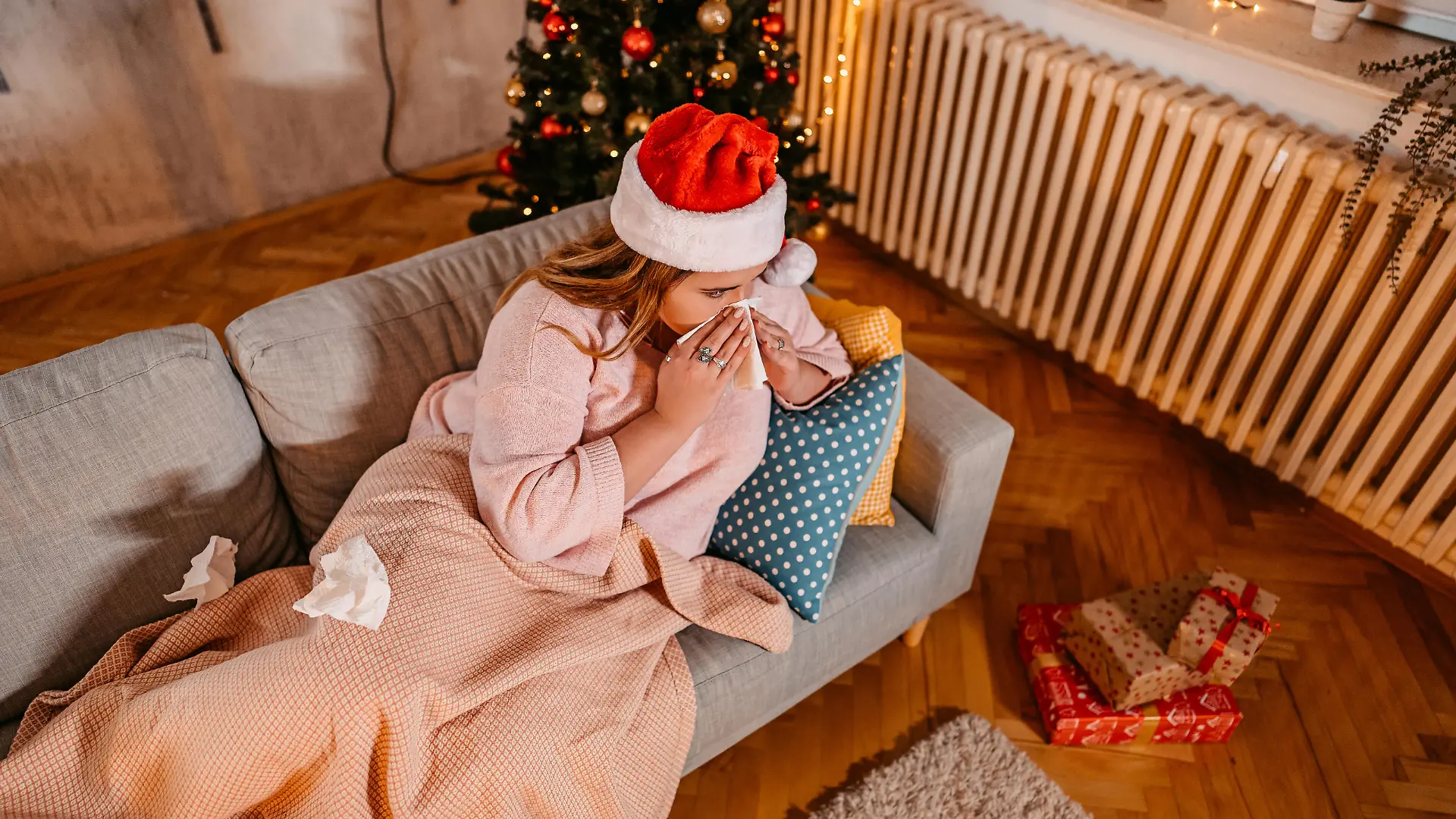 Beautiful young plus size woman being sick at home for Christmas.