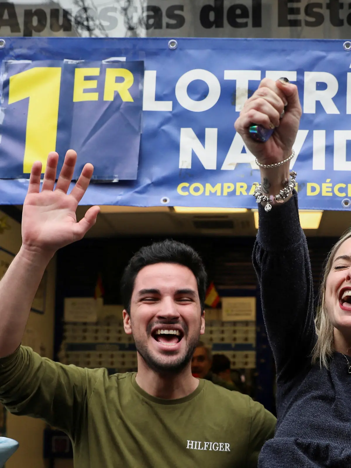 People celebrate winning numbers in Spain's Christmas lottery "El Gordo" (The Fat One), in Madrid, Spain December 22, 2022. REUTERS/Isabel Infantes