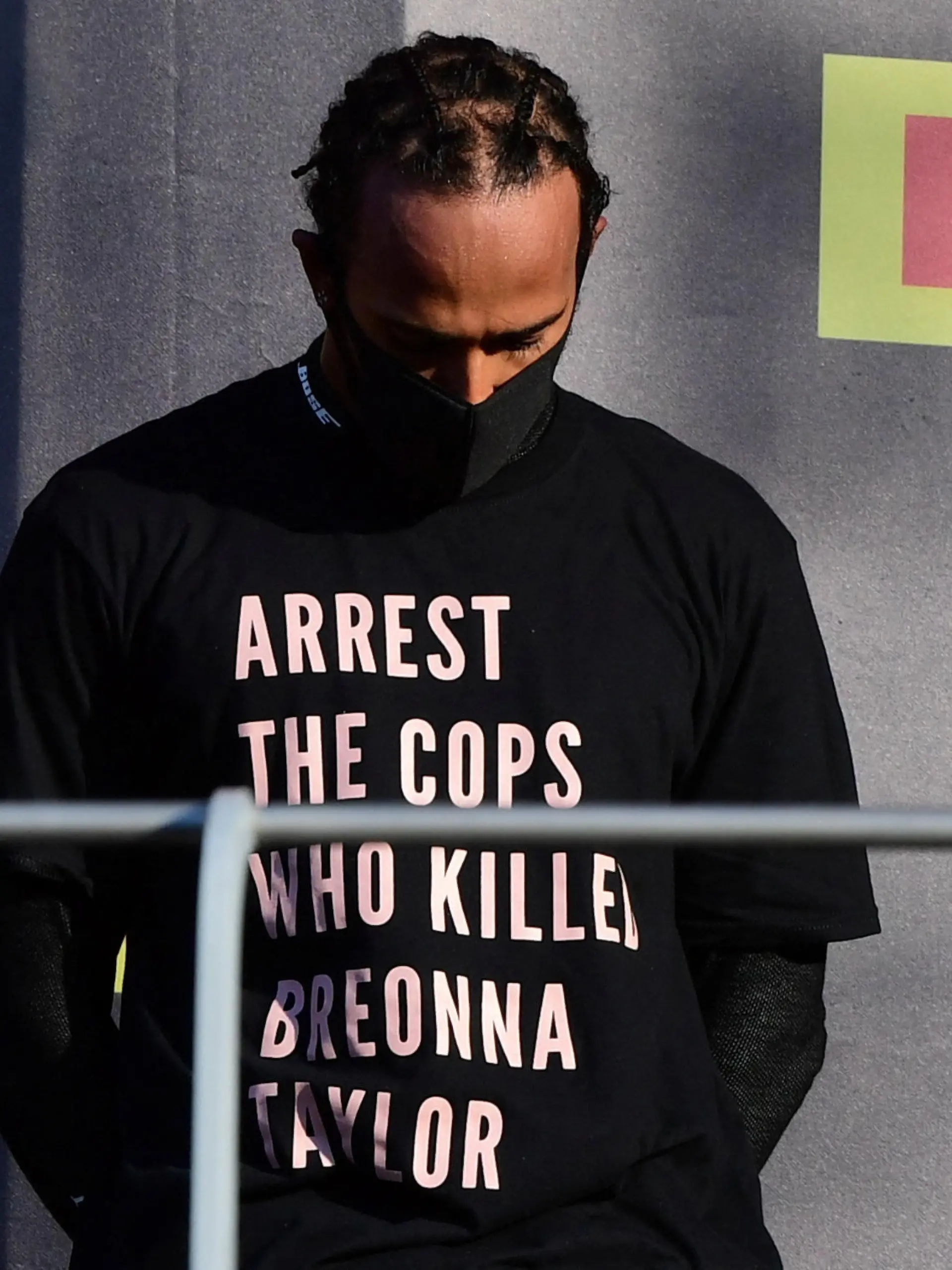 FILE PHOTO: Formula One F1 - Tuscan Grand Prix - Mugello, Scarperia e San Piero, Italy - September 13, 2020 Mercedes' Lewis Hamilton wears a shirt in reference to Breonna Taylor on the podium as he celebrates after winning the race Pool via REUTERS/Jennifer Lorenzini/File Photo