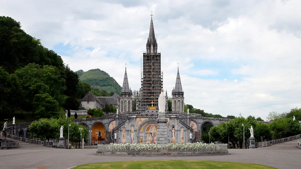 FILE - The closed Basilica of Lourdes is pictured May 8, 2020, in Lourdes, southwestern France. The Vatican came under pressure Tuesday, Dec. 6, 2022, to explain why it didn’t prosecute a famous Jesuit artist and merely let his order restrict the priest's ministry following allegations that he abused his authority over adult women. Mosiacs by Rev. Marko Ivan Rupnik decorate several churches and chapels, including the Lourdes basilica. (AP Photo/Bob Edme, File)