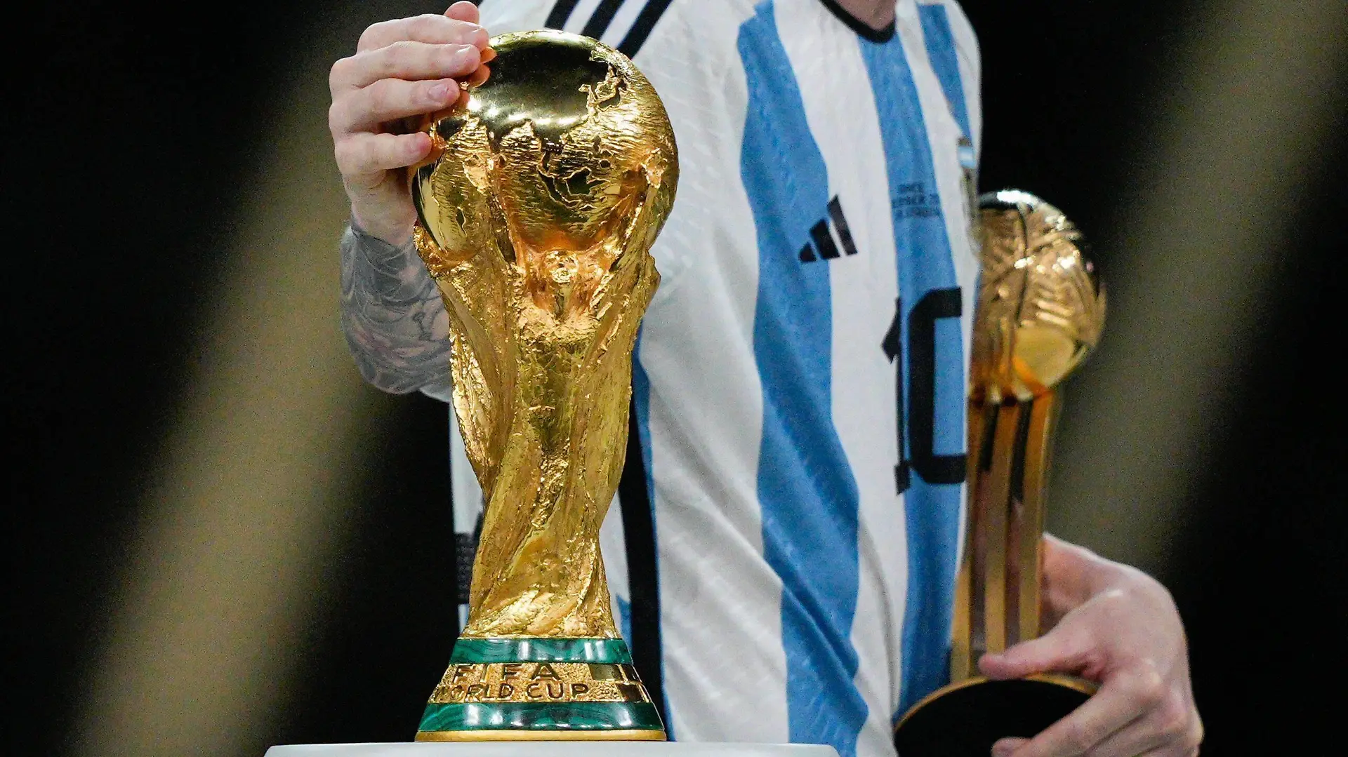 Mandatory Credit: Photo by Dave Shopland/Shutterstock 13670813dv Lionel Messi of Argentina strokes the FIFA World Cup, WM, Weltmeisterschaft, Fussball trophy as he collects the Golden Ball Award Argentina v France, FIFA World Cup 2022, Final, Football, Lusail Stadium, Al Daayen, Qatar - 18 Dec 2022 Editorial Use Only Argentina v France, FIFA World Cup 2022, Final, Football, Lusail Stadium, Al Daayen, Qatar - 18 Dec 2022 Editorial Use Only PUBLICATIONxINxGERxSUIxAUTxHUNxGRExMLTxCYPxROUxBULxUAExKSAxONLY Copyright: xDavexShopland/Shutterstockx 13670813dv