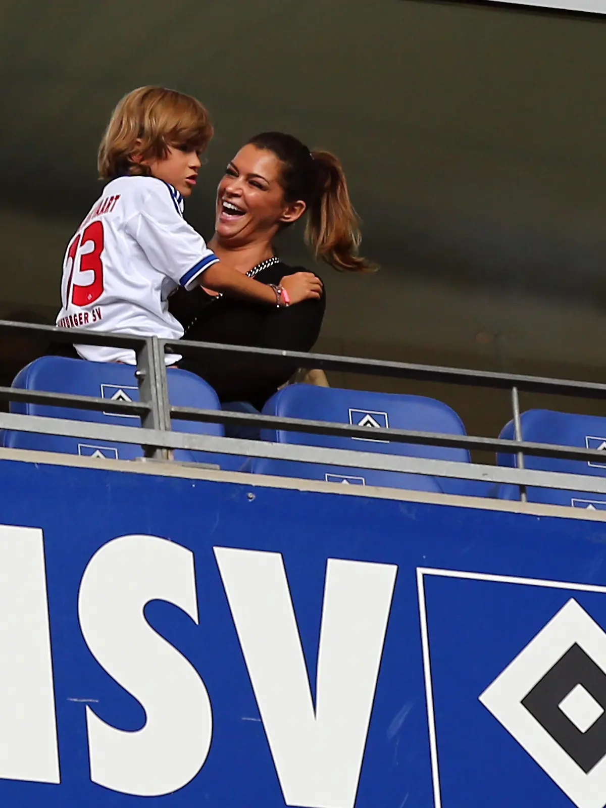 HAMBURG, GERMANY - AUGUST 31:  Sabia Boulharouz (R), girl frien of Rafael van der Vaart and Damian van der Vaart (L) look on before the Bundesliga match between Hamburger SV and Eintracht Braunschweig at Imtech Arena  on August 31, 2013 in Hamburg, Germany.  (Photo by Martin Rose/Bongarts/Getty Images)