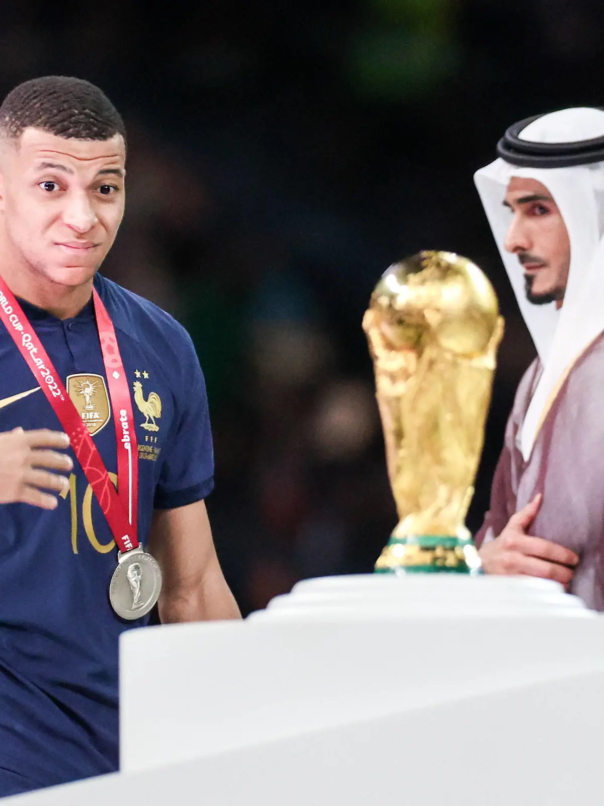  QATAR, LUSAIL - DECEMBER 18, 2022: France captain Kylian Mbappe L is seen during the trophy ceremony for the 2022 FIFA World Cup, WM, Weltmeisterschaft, Fussball final football match between Argentina and France at Lusail Iconic Stadium. Argentina won 3-3 4-2 in a penalty shootout. Sergei Bobylev/TASS PUBLICATIONxINxGERxAUTxONLY 56487383