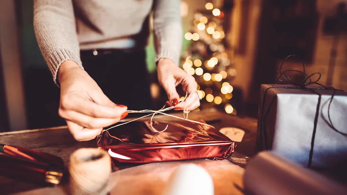 woman making the package for the christmas gift