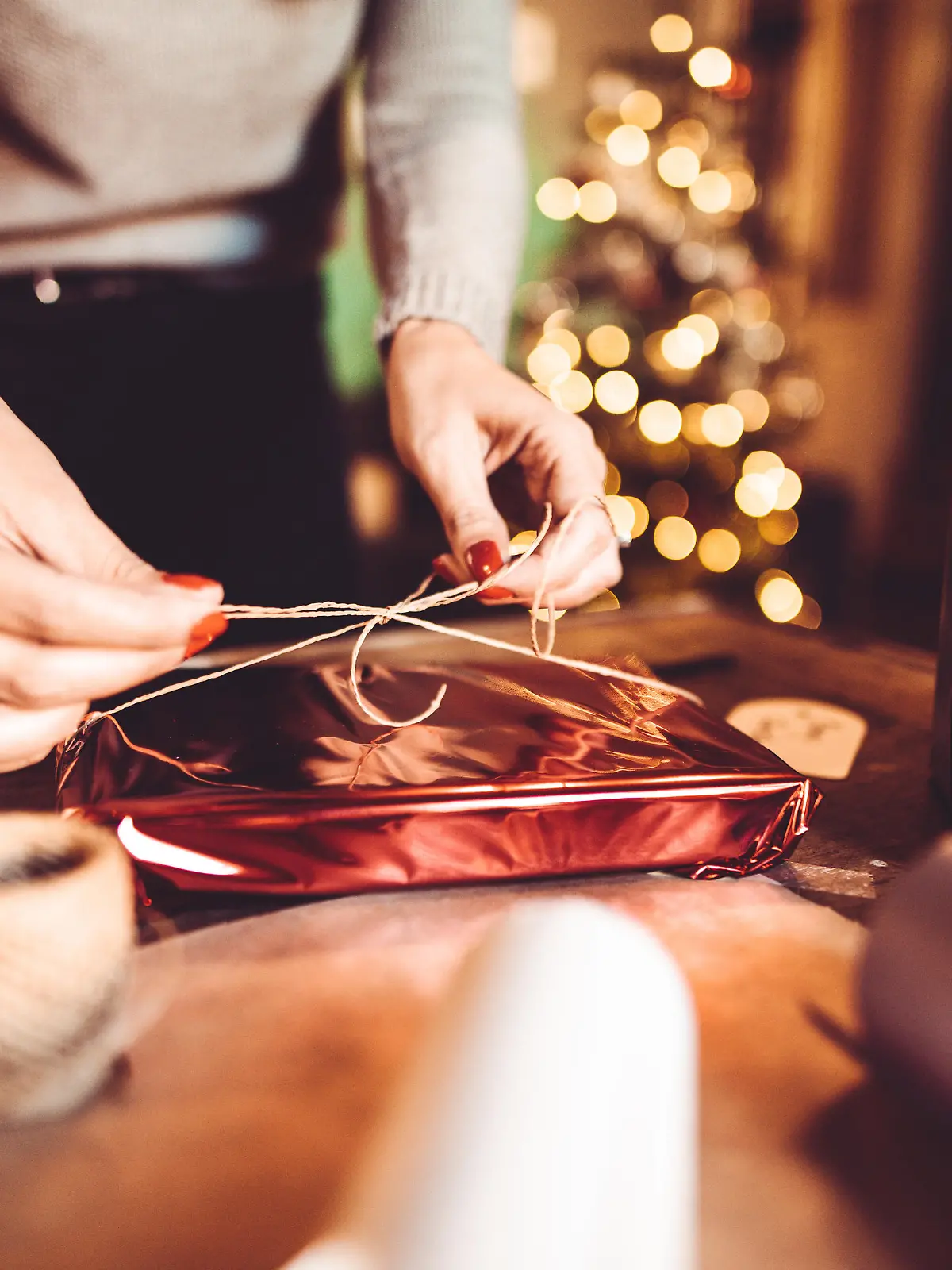 woman making the package for the christmas gift