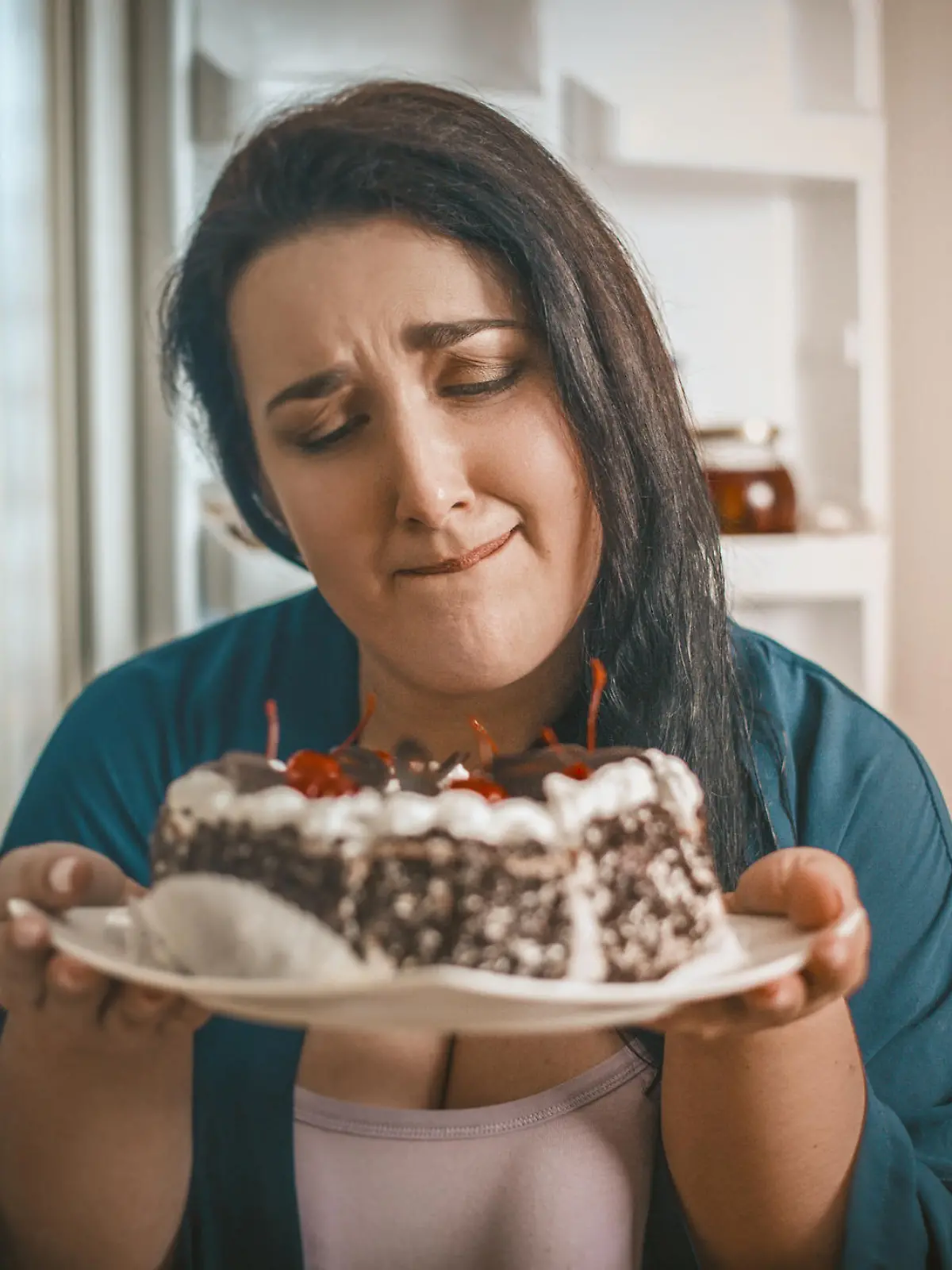 Plus Size Woman Holding A Plate With Chocolate Cherry Cake Passionately Wanting To Eat It, Hungry Woman Wants To Eat Dessert Standing In Front Of An Open Refrigerator