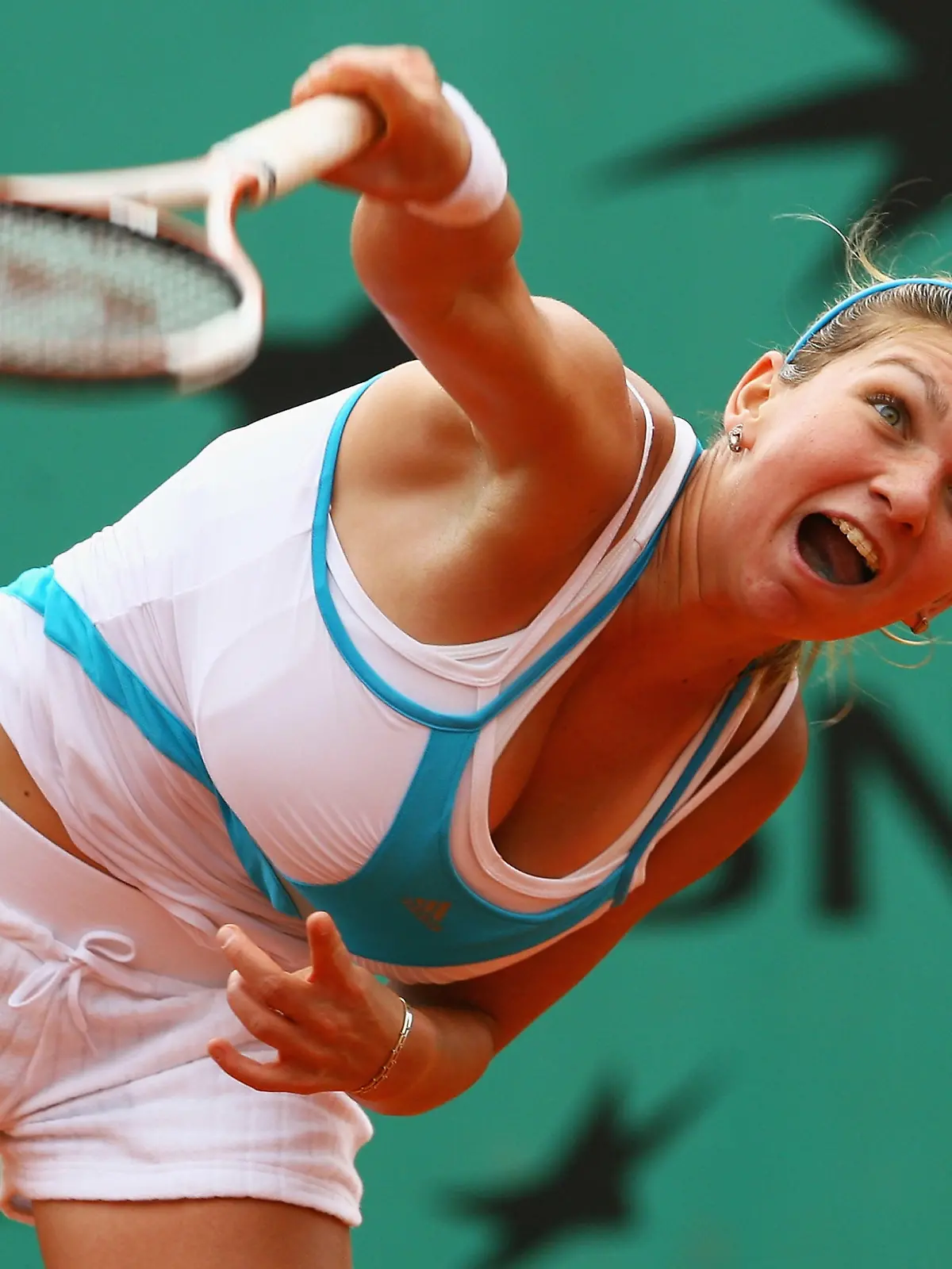 PARIS - JUNE 08:  Simona Halep of Romania serves during the Girl's Singles Final match against Elena Bogdan of Romania on day fifteen of the French Open at Roland Garros on June 8, 2008 in Paris, France.  (Photo by Julian Finney/Getty Images)