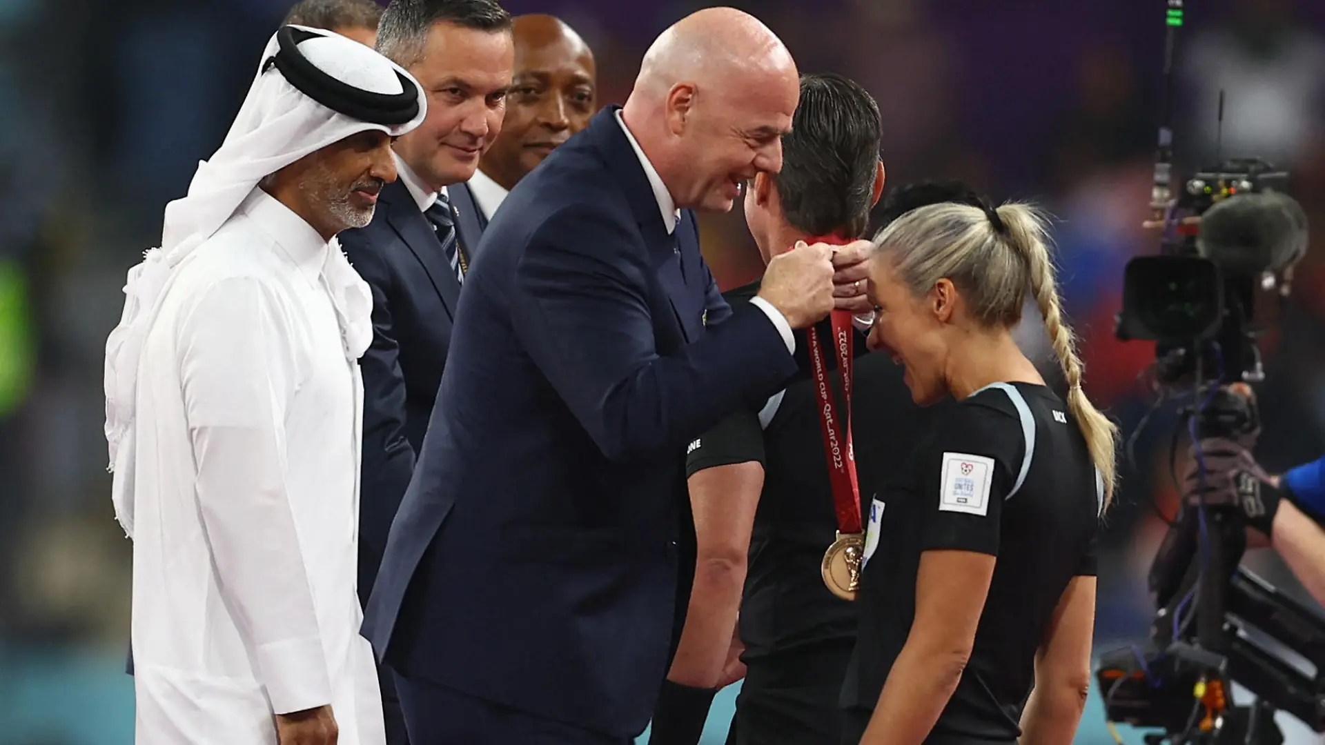 Soccer Football - FIFA World Cup Qatar 2022 - Third-Place Playoff - Croatia v Morocco - Khalifa International Stadium, Doha, Qatar - December 17, 2022 Reserve referee Neuza Back presented with her medal by FIFA president Gianni Infantino REUTERS/Molly Darlington