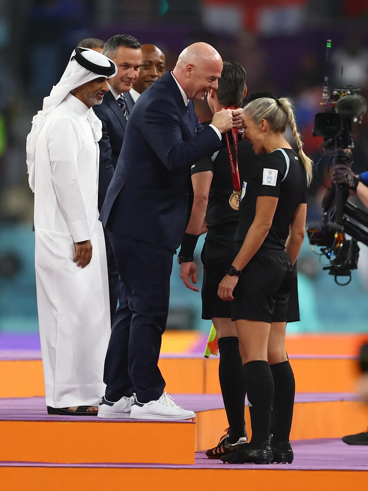 Soccer Football - FIFA World Cup Qatar 2022 - Third-Place Playoff - Croatia v Morocco - Khalifa International Stadium, Doha, Qatar - December 17, 2022 Reserve referee Neuza Back presented with her medal by FIFA president Gianni Infantino REUTERS/Molly Darlington