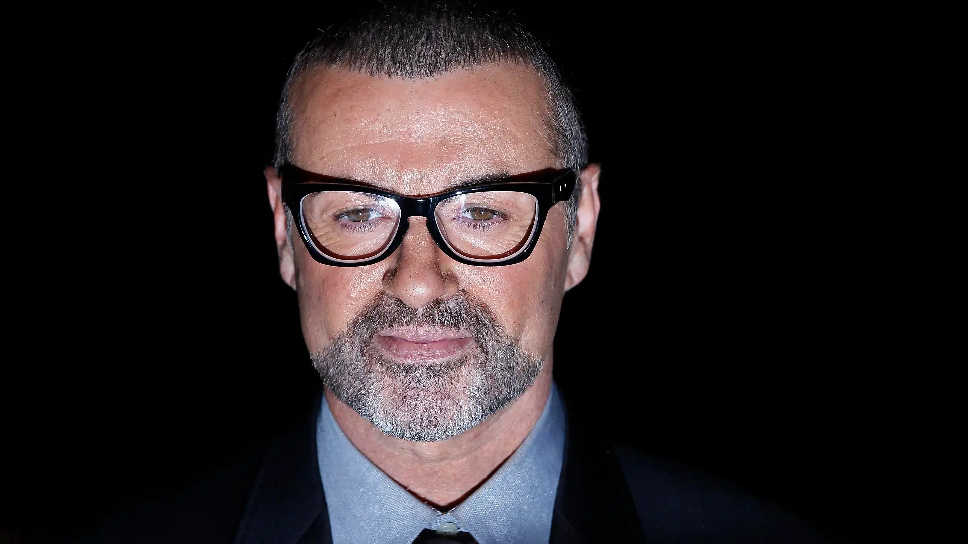 British singer George Michael poses for photographers before a news conference at the Royal Opera House in central London, in this file picture taken May 11, 2011. Michael has received medical treatment for "minor cuts and bruises" after a car crash on May 16, 2013, his publicist said. British media reported that the accident occurred just outside London on a motorway during rush hour.         REUTERS/Stefan Wermuth/Files (BRITAIN - Tags: ENTERTAINMENT HEADSHOT)