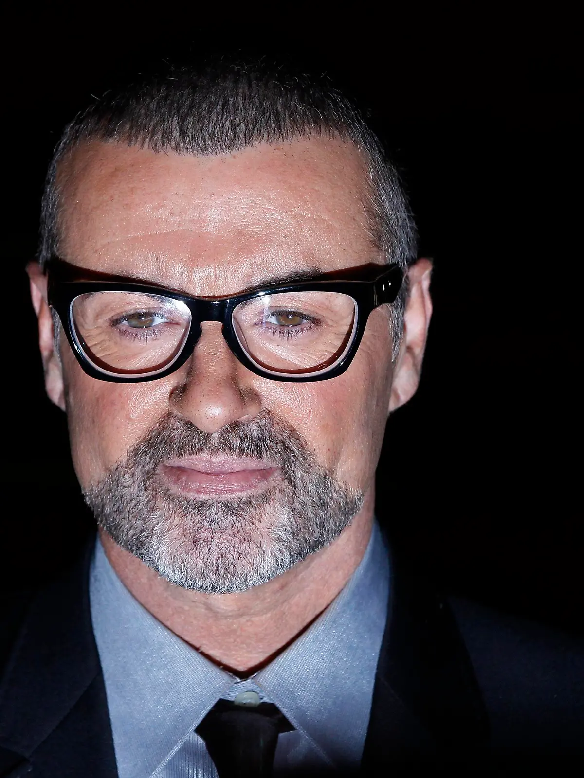 British singer George Michael poses for photographers before a news conference at the Royal Opera House in central London, in this file picture taken May 11, 2011. Michael has received medical treatment for "minor cuts and bruises" after a car crash on May 16, 2013, his publicist said. British media reported that the accident occurred just outside London on a motorway during rush hour.         REUTERS/Stefan Wermuth/Files (BRITAIN - Tags: ENTERTAINMENT HEADSHOT)