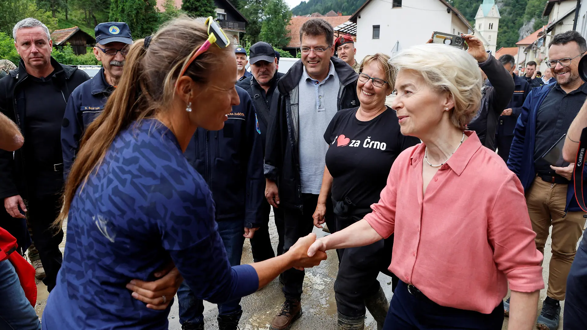 European Commission President Ursula von der Leyen shakes hands with Slovenian alpine ski racer Tina Maze, as she visits affected areas after northern and western parts of the country were hit by torrential rains causing floods, cutting power and disrupting traffic, in Crna na Koroskem, Slovenia August 9, 2023. REUTERS/Borut Zivulovic