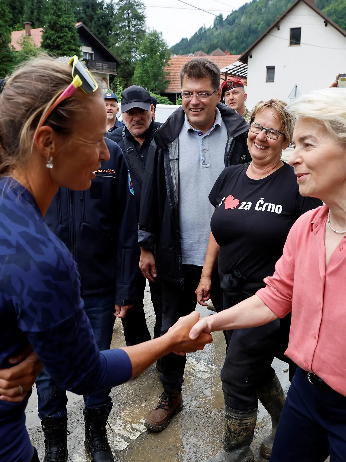 European Commission President Ursula von der Leyen shakes hands with Slovenian alpine ski racer Tina Maze, as she visits affected areas after northern and western parts of the country were hit by torrential rains causing floods, cutting power and disrupting traffic, in Crna na Koroskem, Slovenia August 9, 2023. REUTERS/Borut Zivulovic