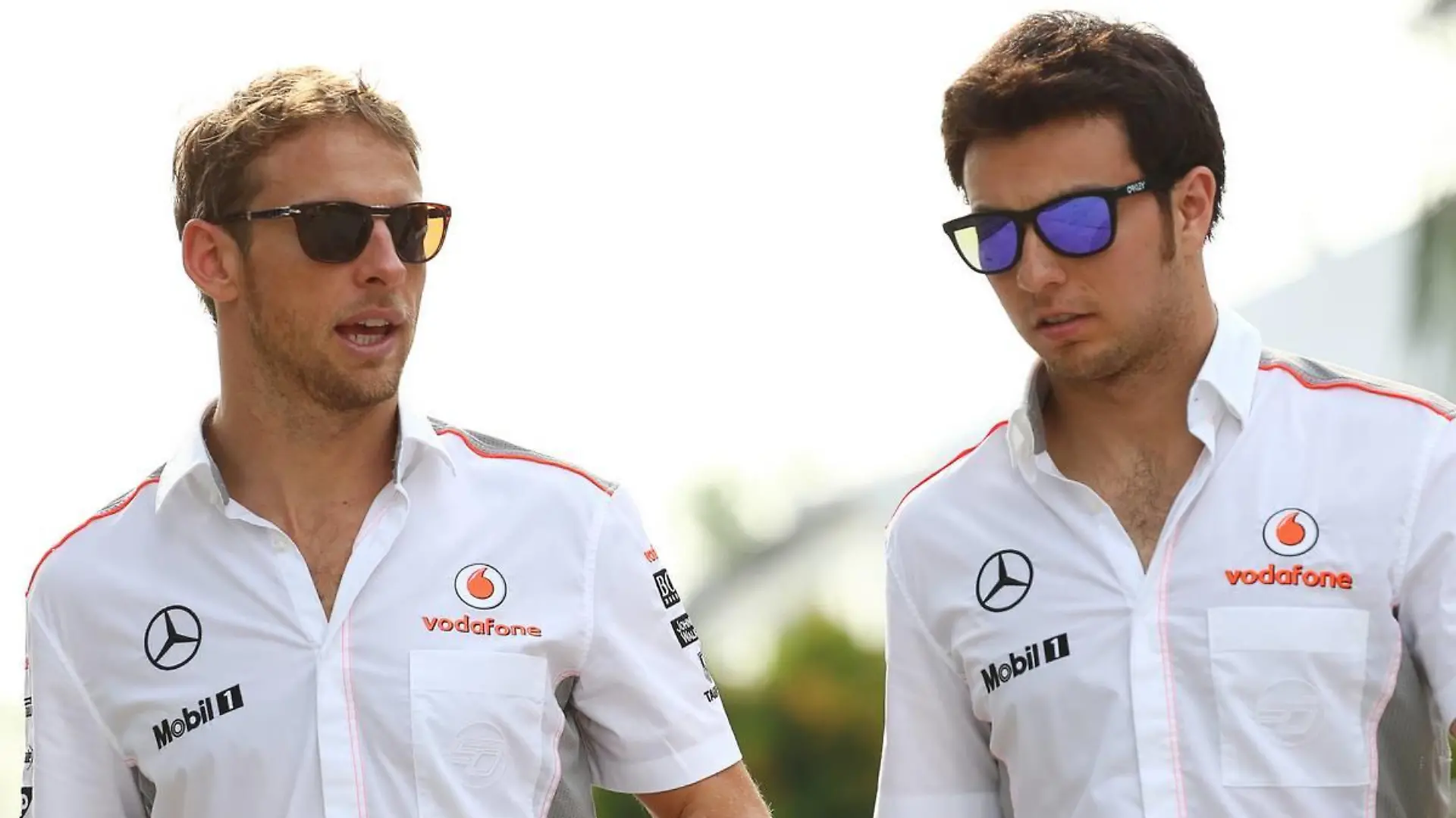 (L to R): Jenson Button (GBR) McLaren with team mate Sergio Perez (MEX) McLaren.22.03.2013. Formula 1 World Championship, Rd 2, Malaysian Grand Prix, Sepang, Malaysia, Friday. - www.xpbimages.com, EMail: requests@xpbimages.com - copy of publication required for printed pictures. Every used picture is fee-liable. © Copyright: Kalisz / XPB Images