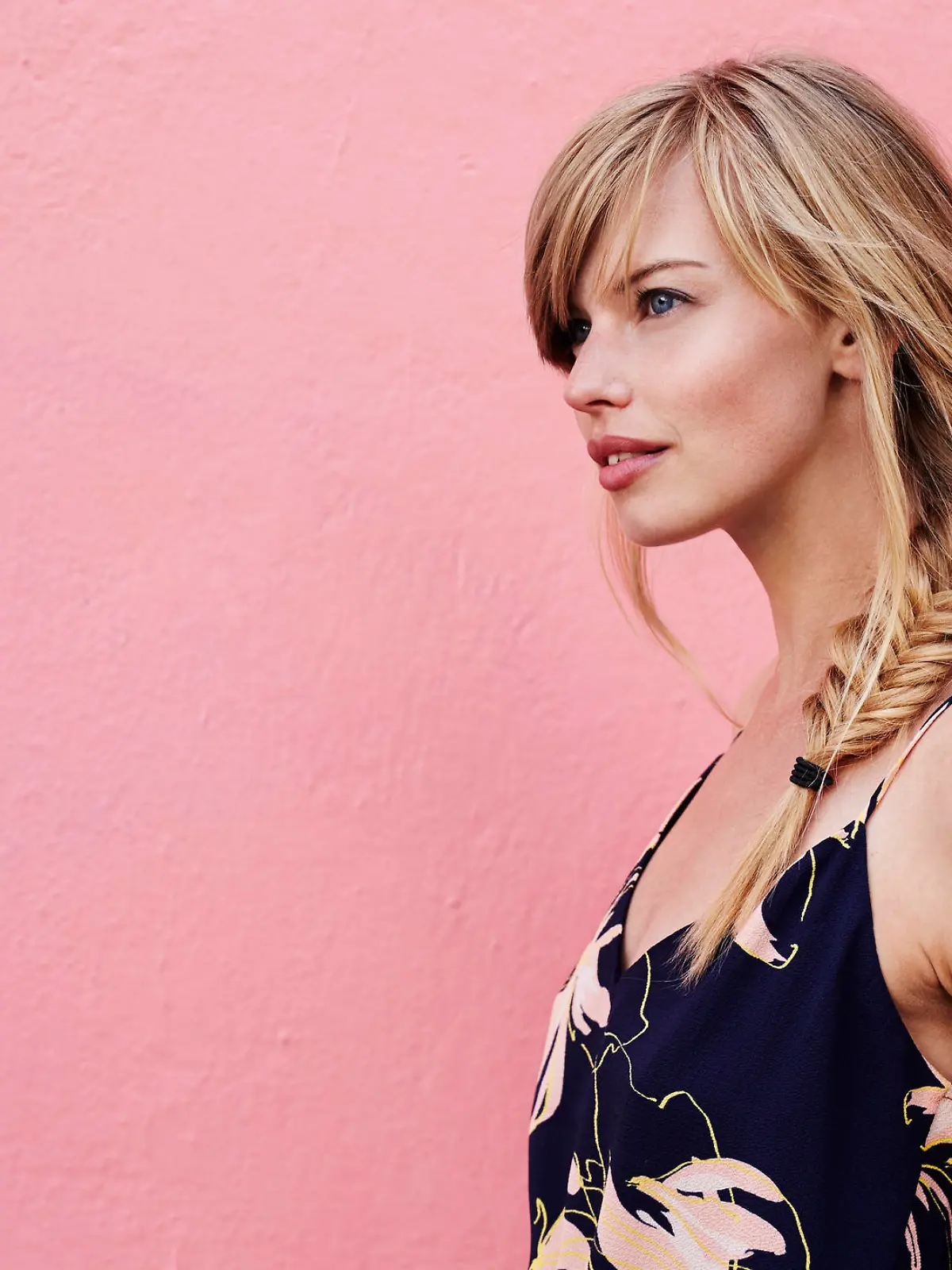 Gorgeous blond woman against pink background