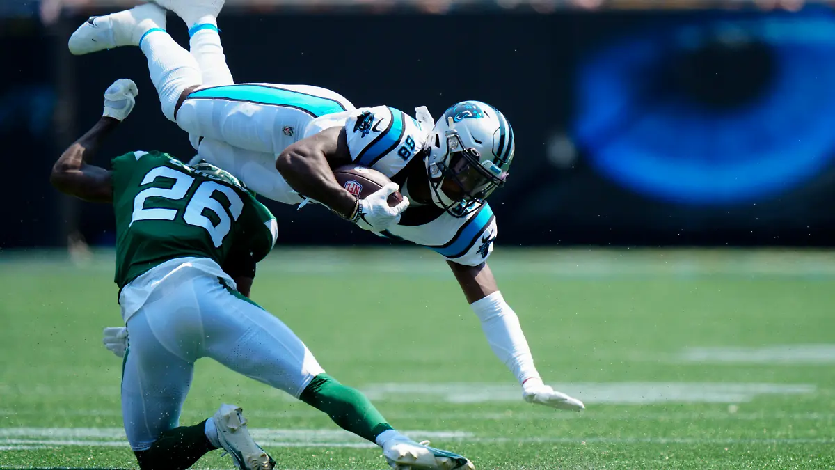 Carolina Panthers wide receiver Terrace Marshall Jr. is tackled by New York Jets cornerback Brandin Echols during the first half of an NFL football game Sunday, Sept. 12, 2021, in Charlotte, N.C. (AP Photo/Jacob Kupferman)