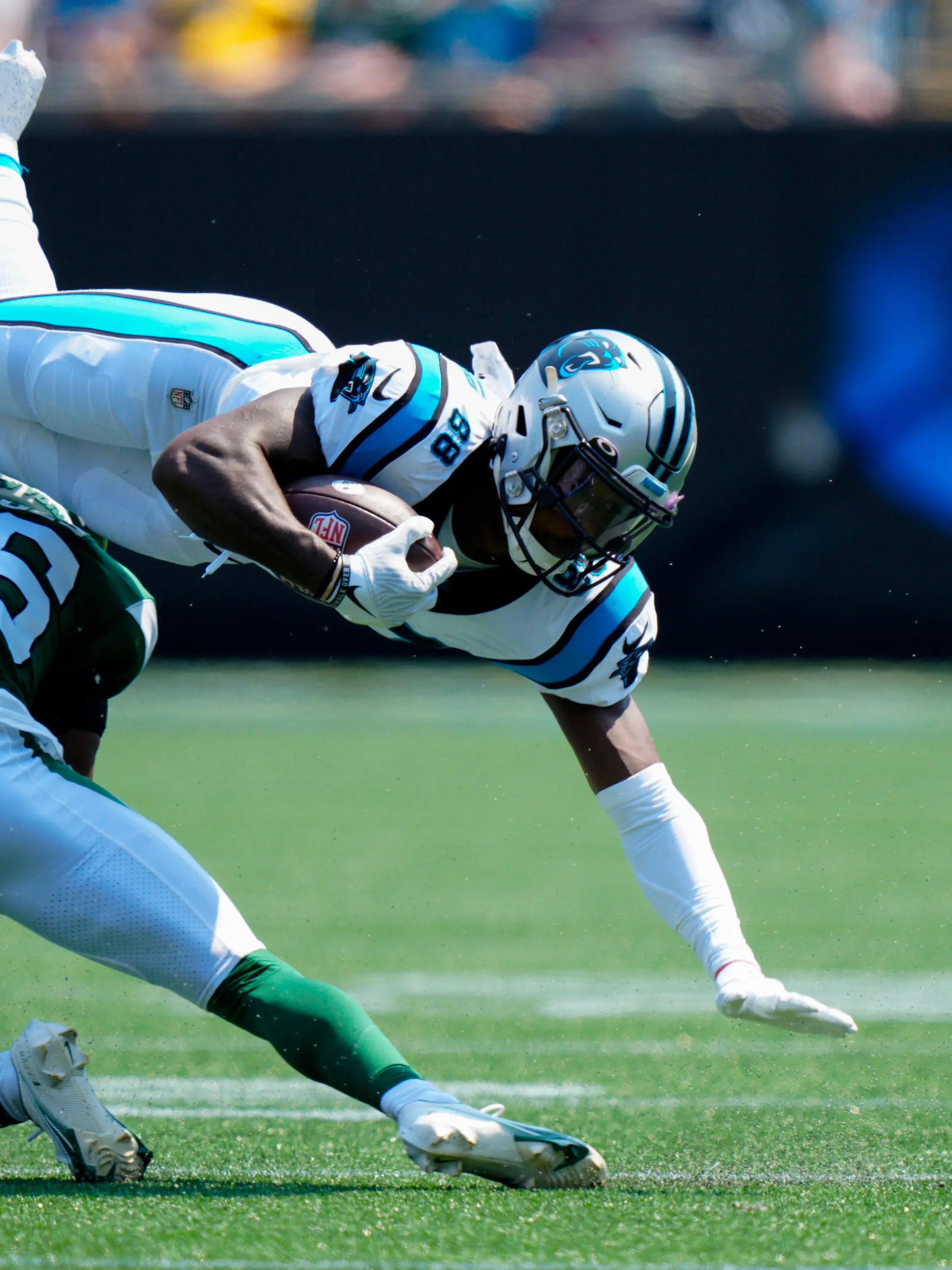 Carolina Panthers wide receiver Terrace Marshall Jr. is tackled by New York Jets cornerback Brandin Echols during the first half of an NFL football game Sunday, Sept. 12, 2021, in Charlotte, N.C. (AP Photo/Jacob Kupferman)